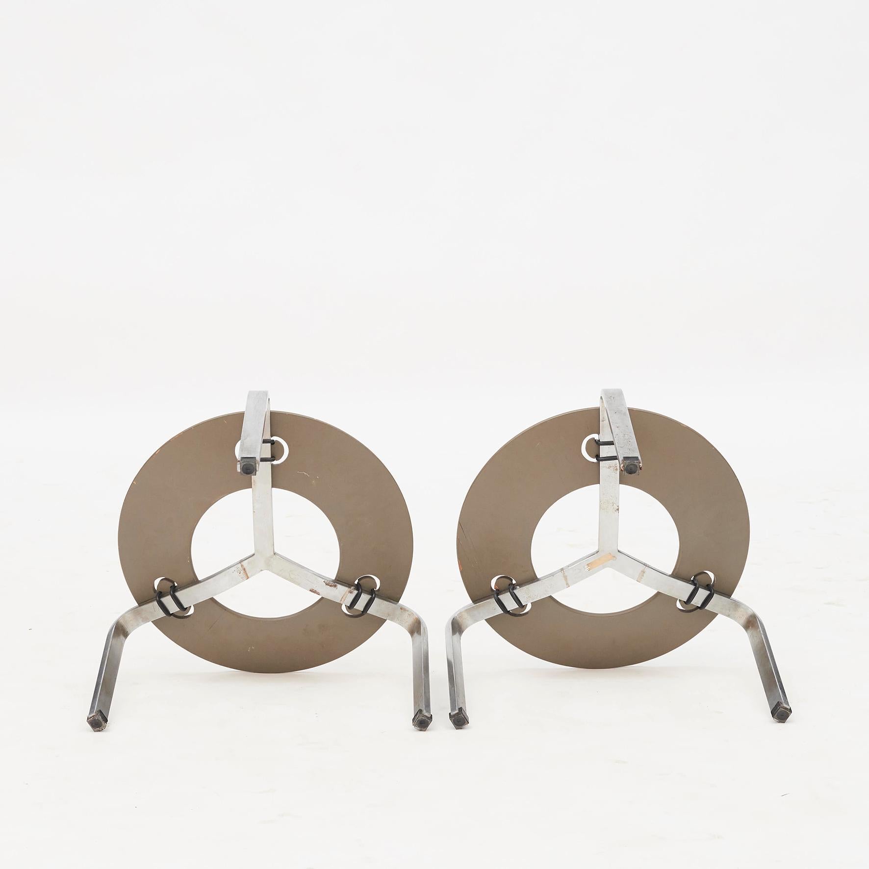 Pair of Poul Kjærholm (1929-1980) footstool model PK33. Matte chromed spring steel frame with a round cognac-colored patinated leather cushion. Maker's mark on underside.
Designed in 1959. Produced, stamped, and labelled by Fritz Hansen,