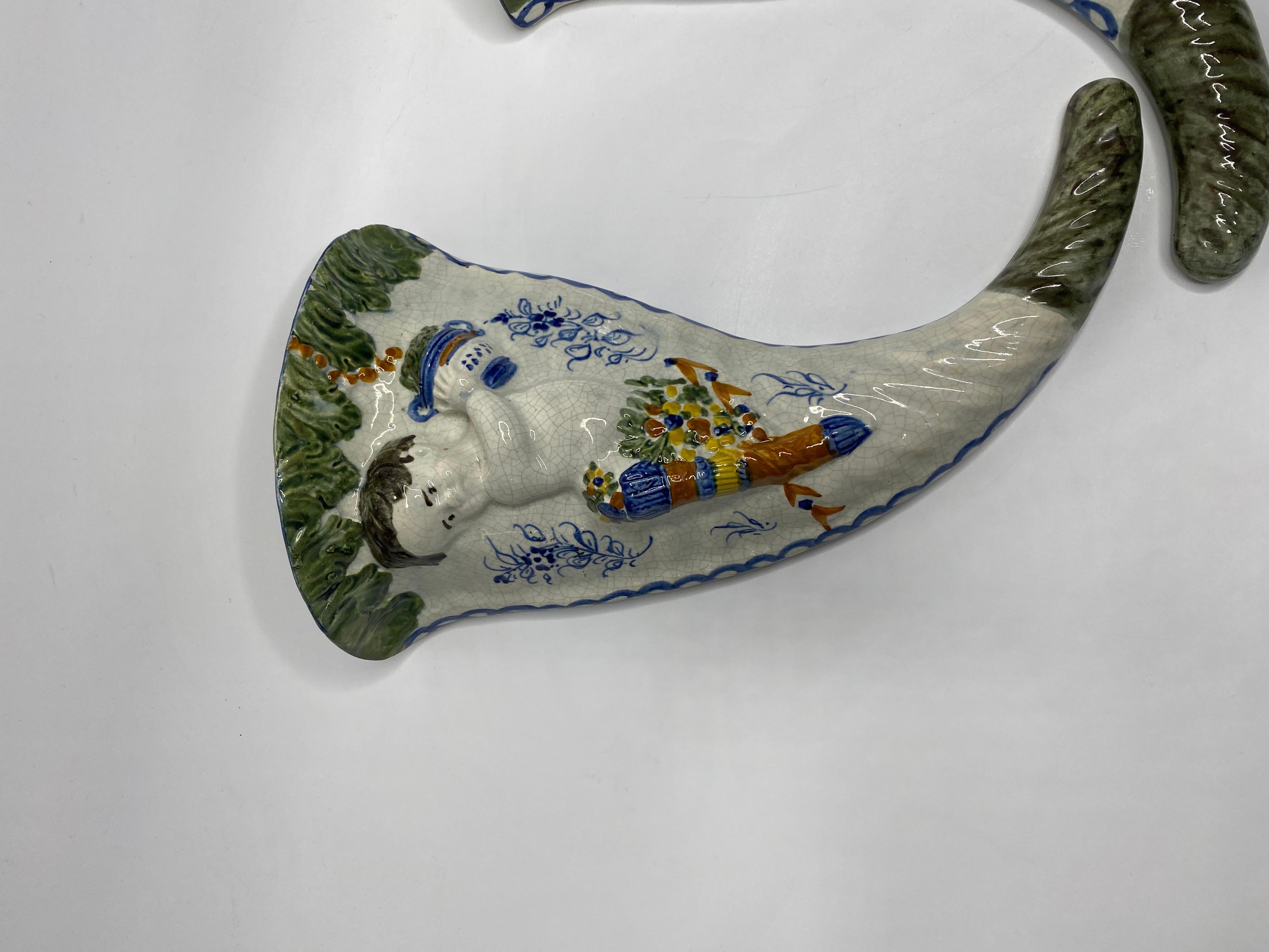 Pottery Pair Prattware Cupid wall pockets, c. 1810. For Sale