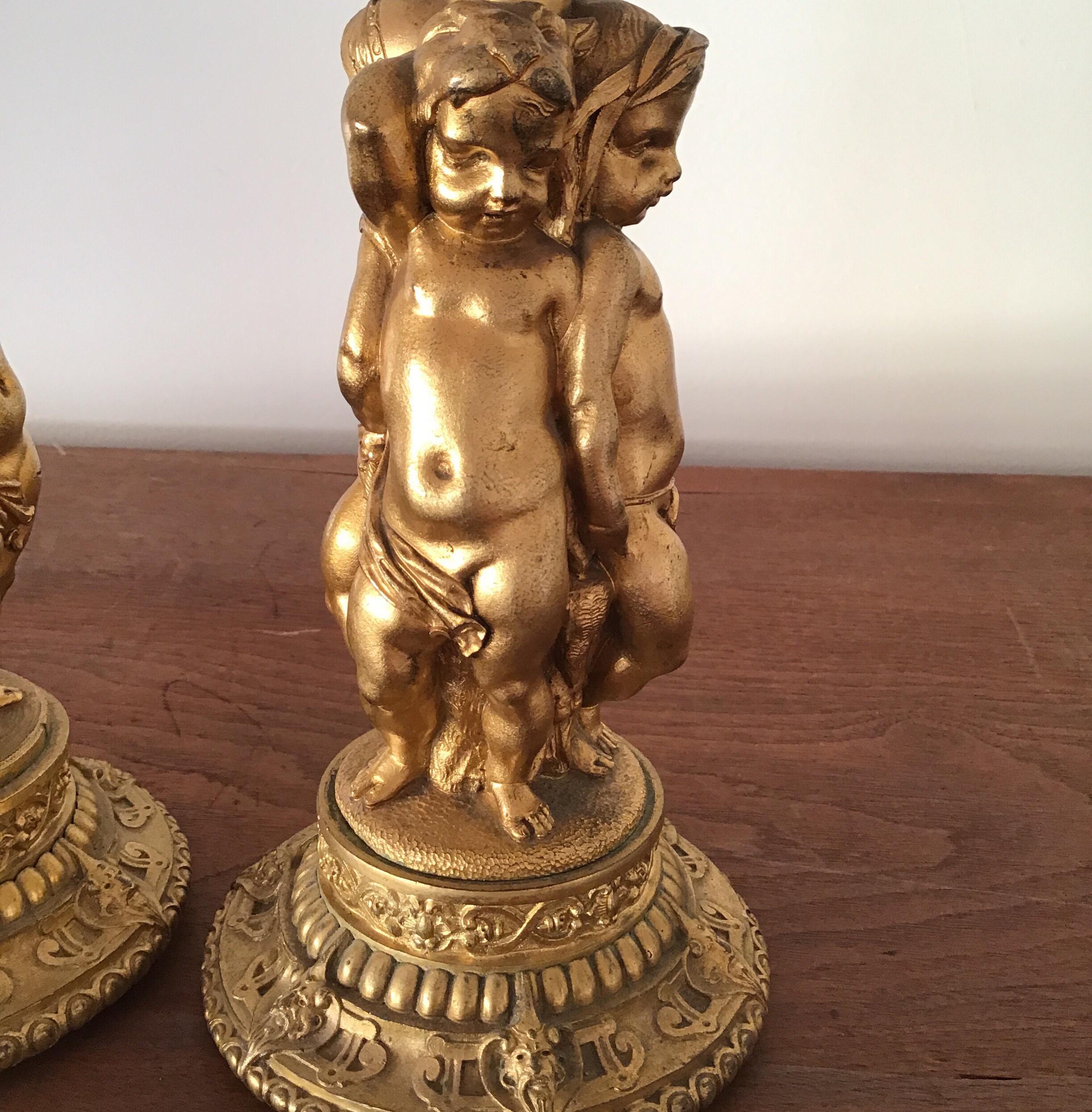 Pair of Figural Cherubs Ormolu   Candlesticks 1920's In Good Condition For Sale In Douglas Manor, NY