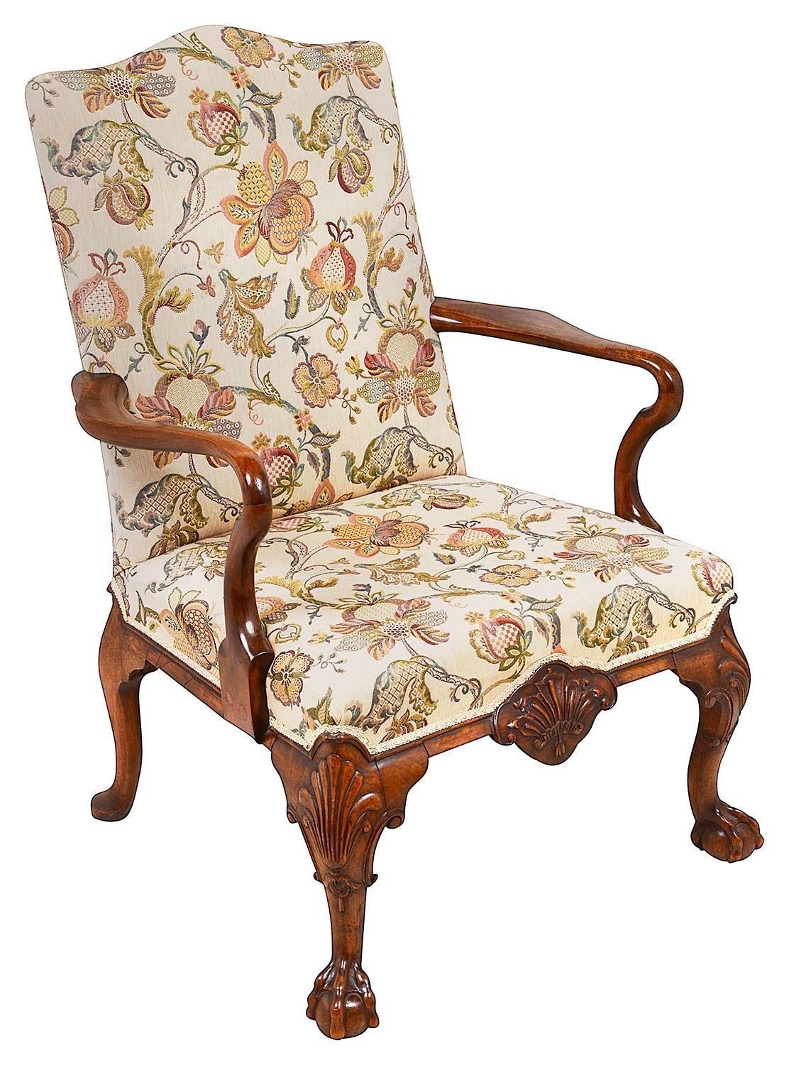 A very good quality pair of Walnut Queen Anne style arm chairs, each with upholstered back rest and stuff over seats, Shepard crook arm rests, raised on wonderful hand carved cabriole legs, each with  shell like decoration, also to the frieze, the