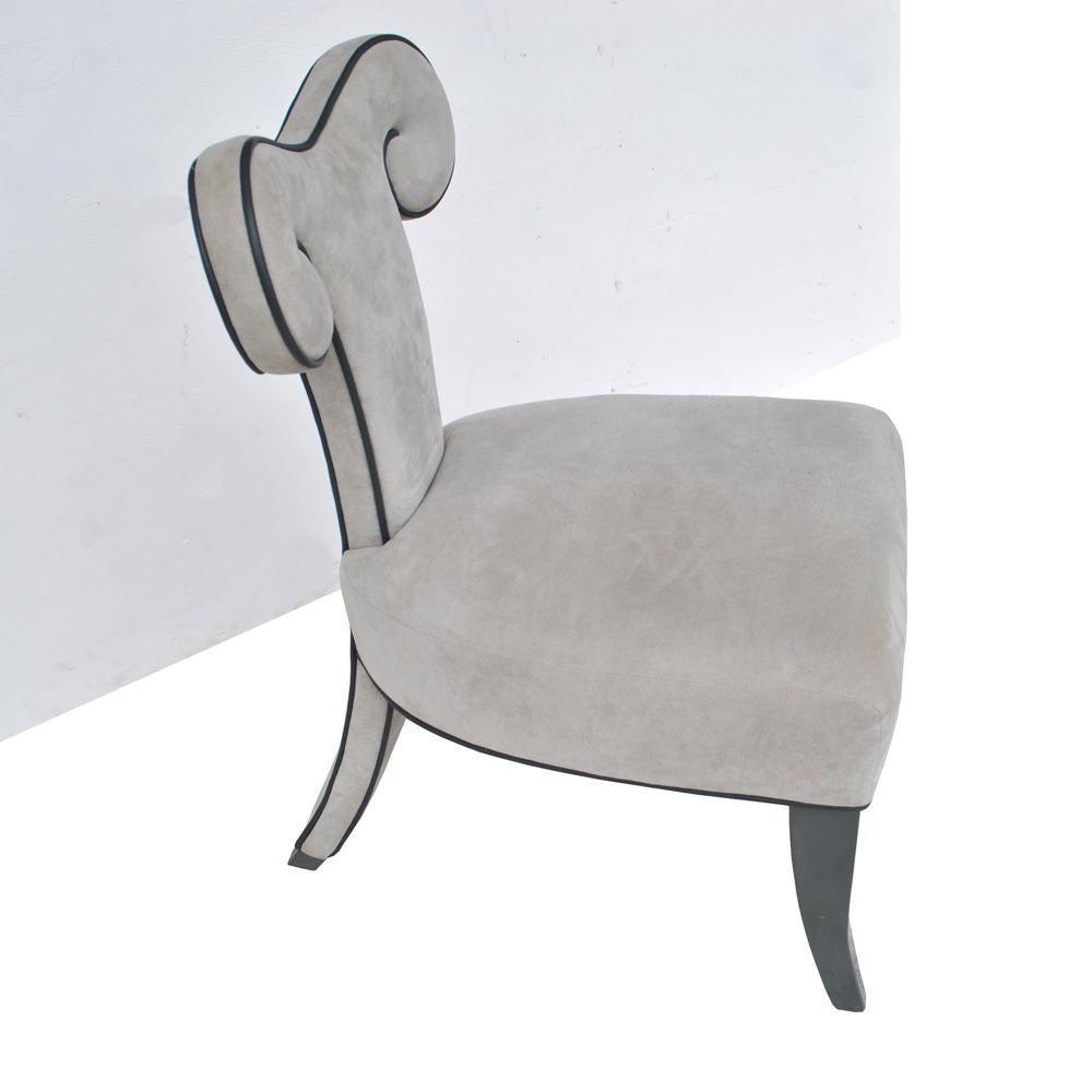 Pair of ram’s head dining side chairs by Brueton,
1990s 

Rare pair of Brueton side/dining chairs in grey ultrasuede. 
Dramatic back with detailing in black piping.