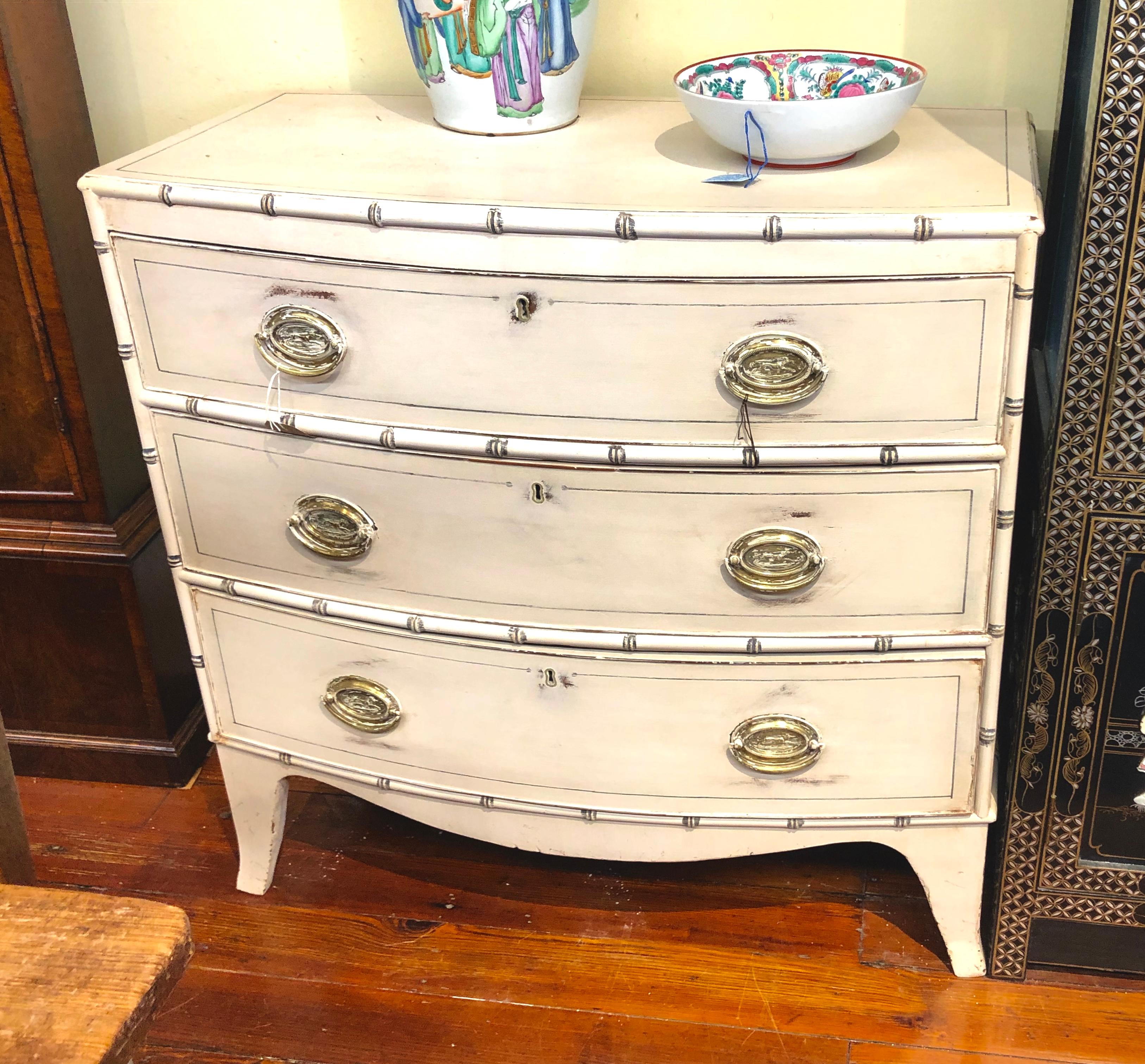 Extremely rare and fine  NEAR pair antique English Regency period painted (over mahogany) small Bowfront chests with Faux Bamboo mouldings along top edge and drawer edge. Pairs of period chests are nearly impossible to find.
These period chests are