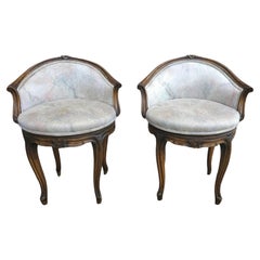 Pair Régence Style Fruitwood and Upholstered Swivel Bergere Chairs