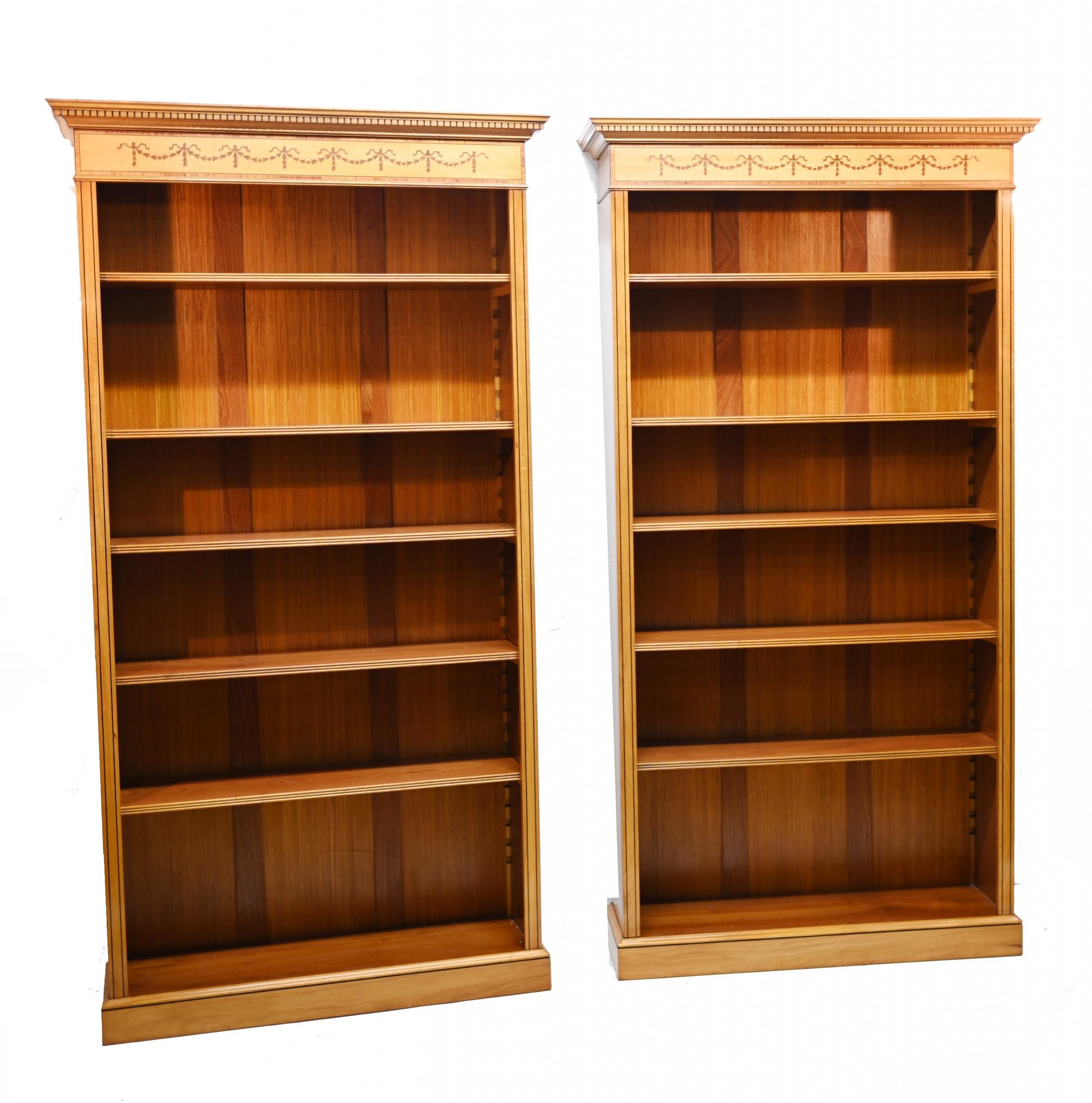 Stunning pair of English Regency style bookcases in gorgeous satinwood
We normally have similar bookcases in mahogany so it was a joy to find these in satinwood - perfect for modern interiors
Bookcases feature intricate marquetry inlay in the shape