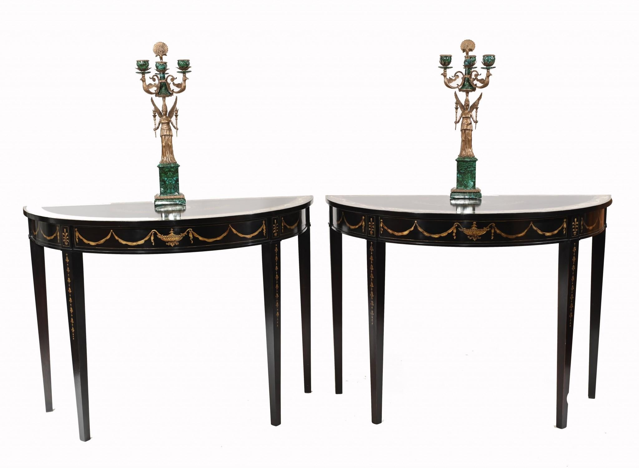 Gorgeous pair of Regency style console tables in the Adams manner
Features a lovely black lacquer finish with hand painted details
Painted details include floral motifs and arabesques
Clean and minimal design perfect for modern interiors
Some of our