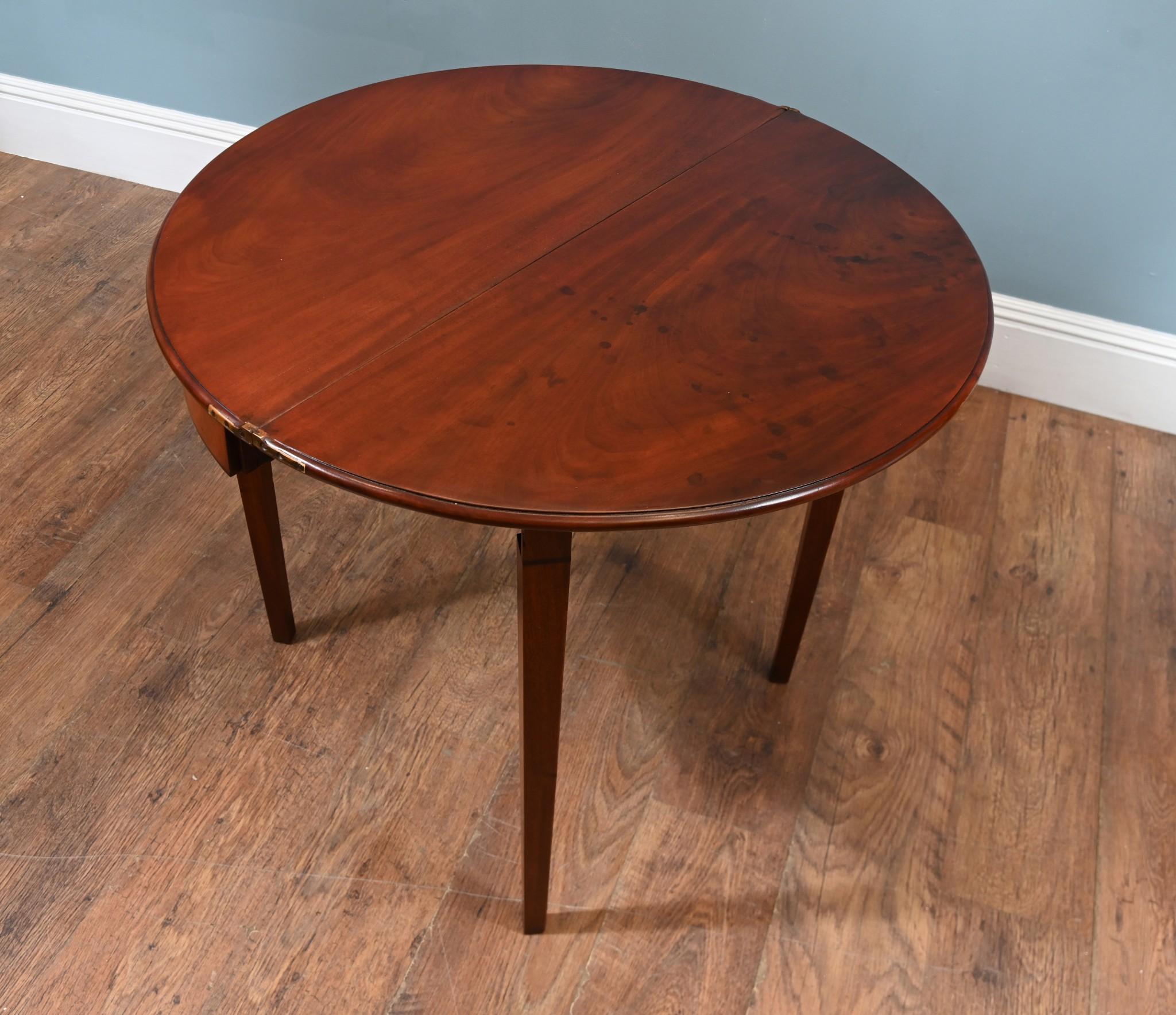 A pair of mahogany 19th century console tables refinished to a high standard ready for home use
The elliptical tops have a pie crust entrigale molding around the tops and the legs are decorated at the top with petal motifs
Circa 1820 Period