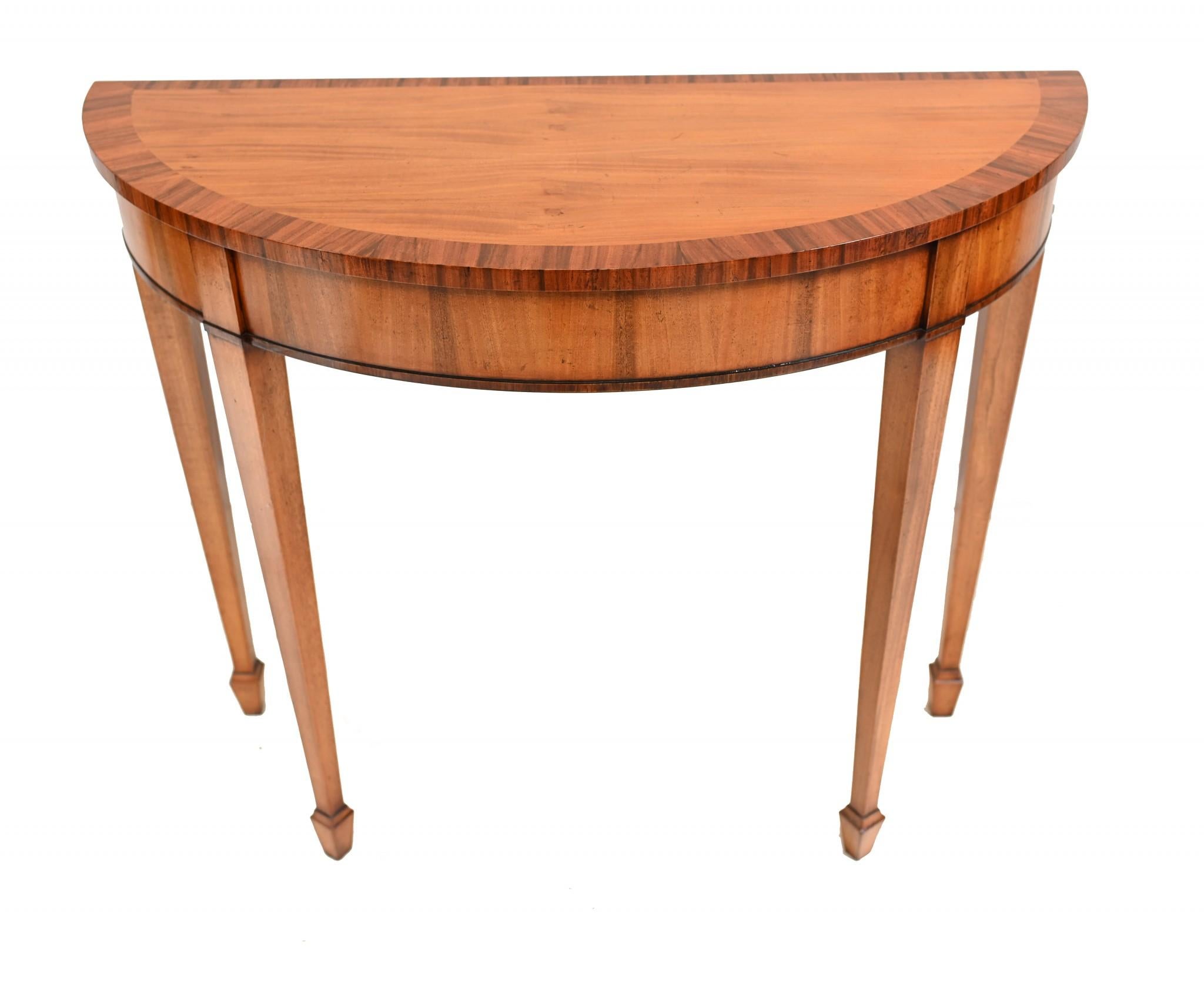Pair of satinwood demi lune console tables in the Regency manner
Such an elegant and refined design with the tapered legs
Classic piece of furniture great for any interior
Offered in great shape ready for home use right away
We ship to every