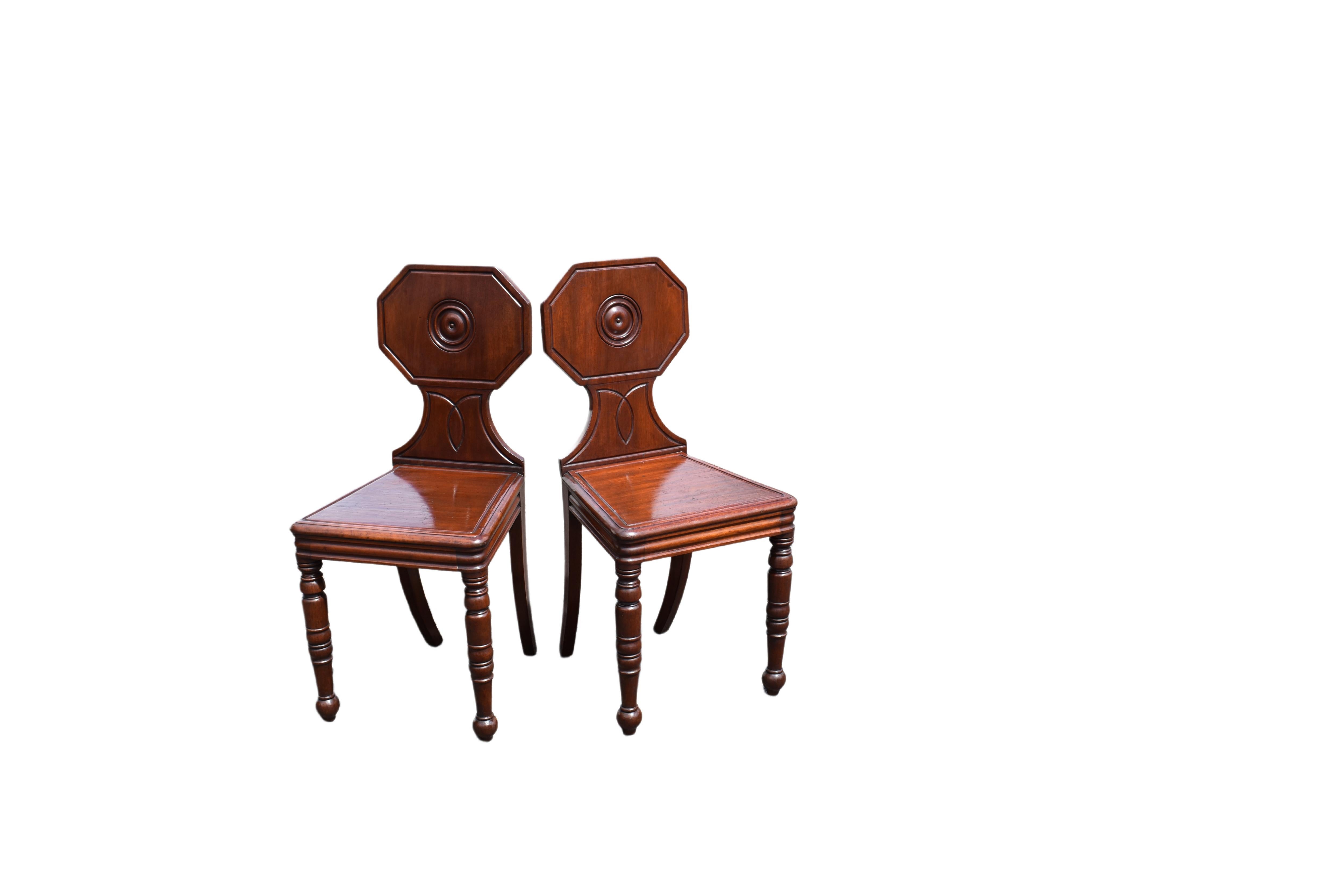 Carved Pair Regency hall chairs