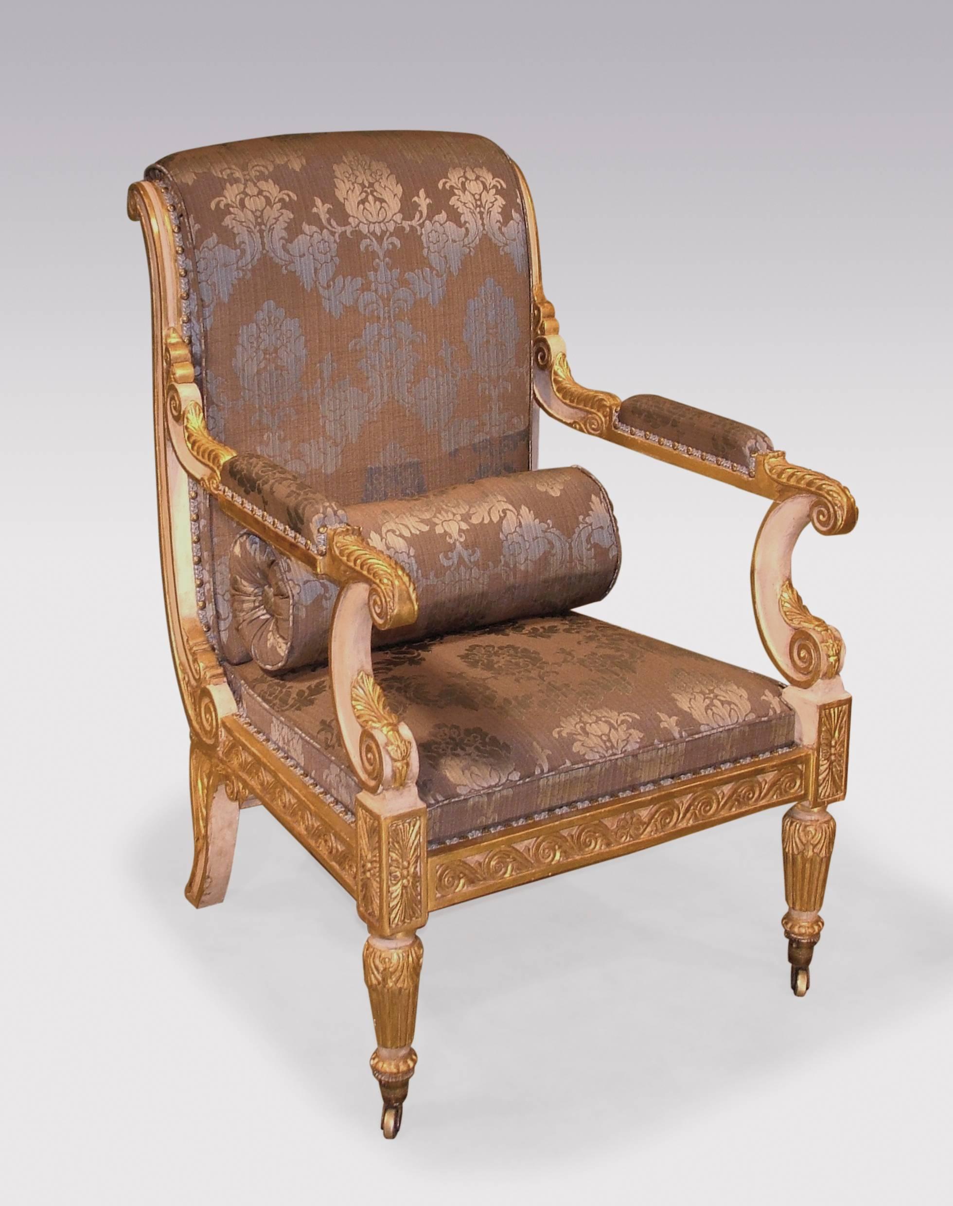 An impressive pair of early 19th century Regency period white painted and carved giltwood armchairs, in the manner of Morel and Hughes, acanthus and scroll carved throughout. The chairs with roll-over backs and stuff-over seats, above Vitruvian