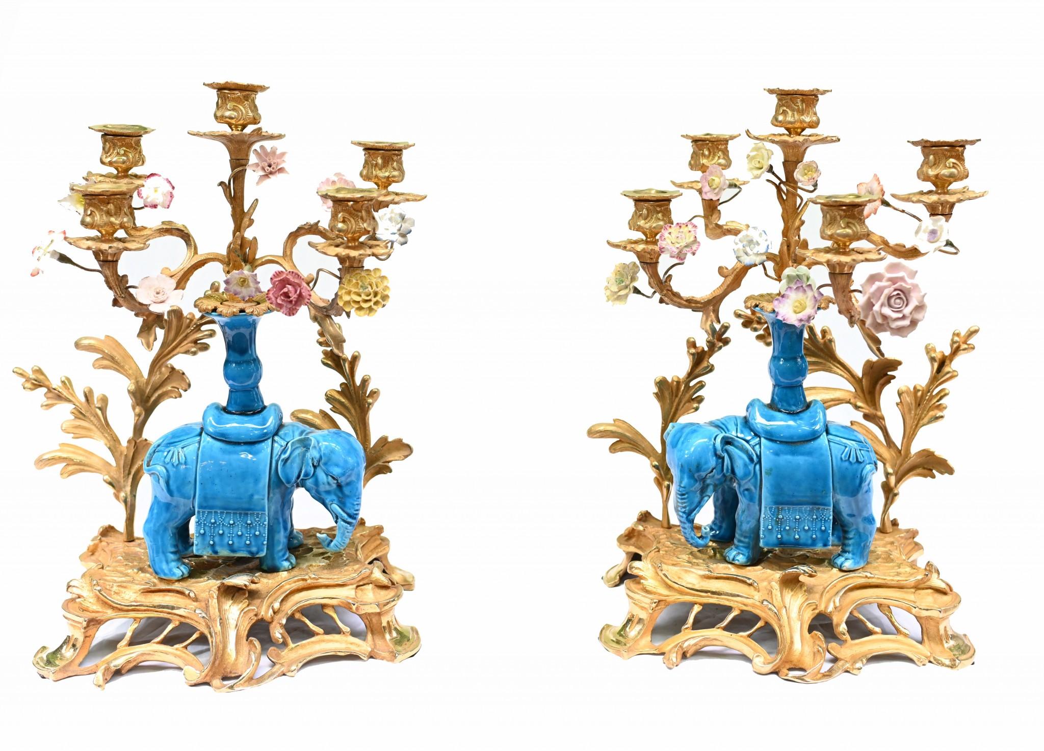 Stunning pair of porcelain elephant and gilt candelabras
Such a great look to this eye catching pair which are a perfecct left and right
The elephant spports the five branches of the candelabras
There are also various encrusted porcelain flowers
The