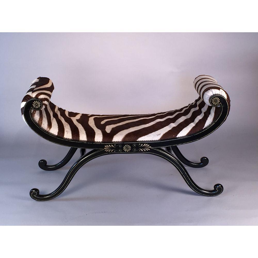 A very well-drawn, highly decorative and sophisticated pair of Regency-style window seats.
Finely decorated by hand, in grey, with anthemions (anthemia) and lines, on an ebonised ground.
Of superb quality.

Now upholstered in genuine zebra hide, and