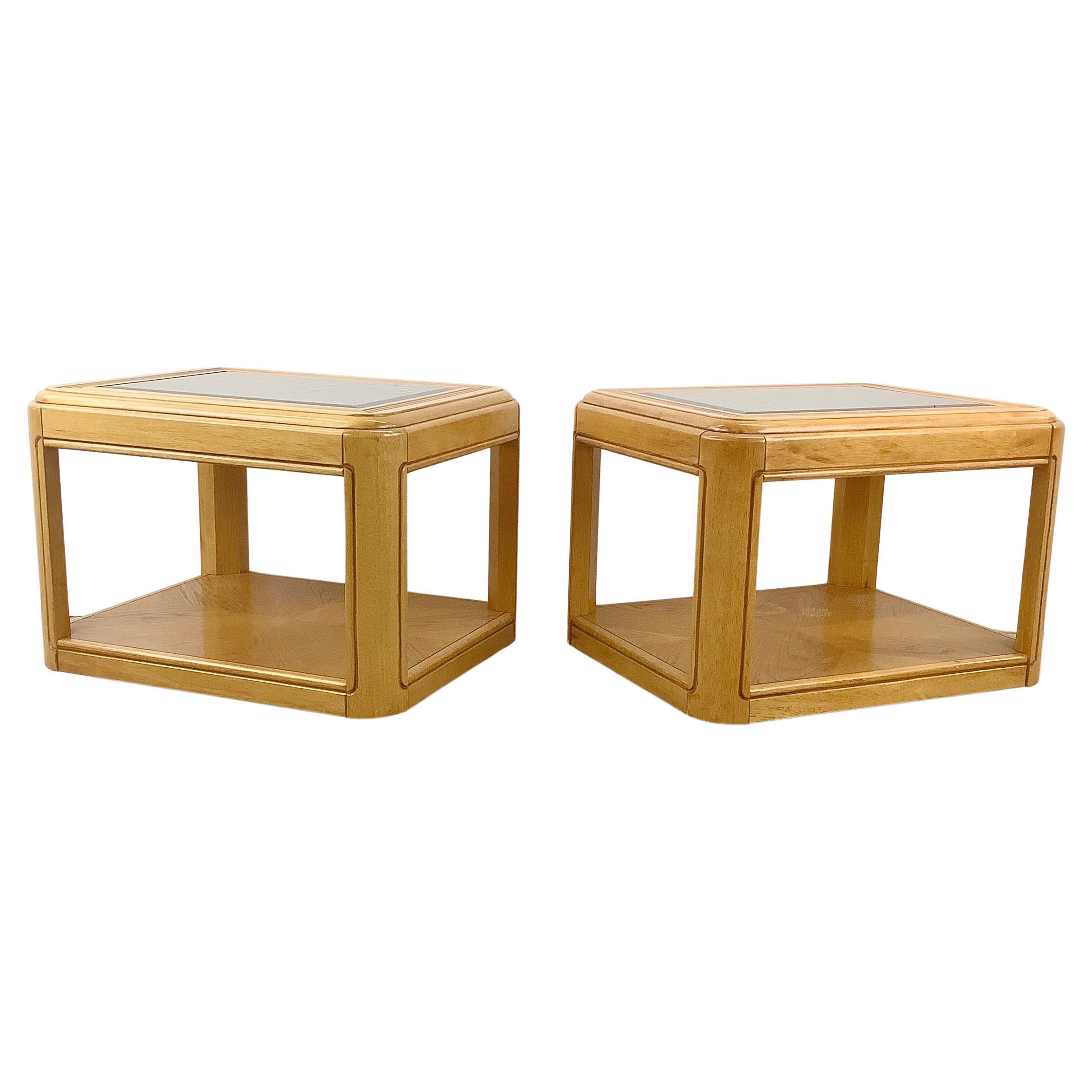 This pair of 1980s Two Tier Oak End Tables feature a harmonious blend of classic design and modern functionality. These tables are a must-have for anyone with a penchant for vintage chic and sustainable living.

Crafted in the 1980s these tables