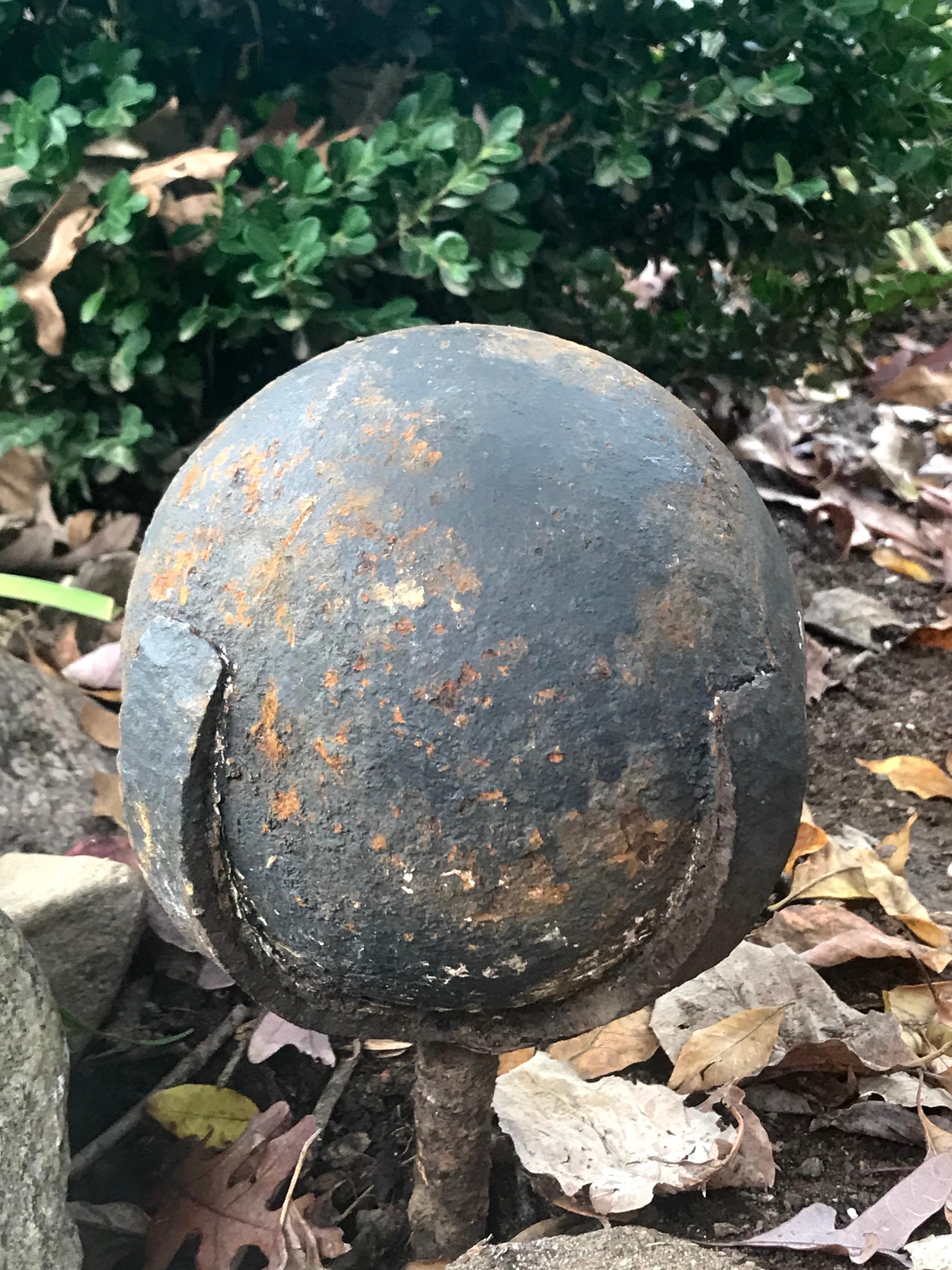 Pair of revolutionary war cannonball finials. Pair of heavily patinaed antique cannon balls, mounted on three pronged spike for garden ornaments or ready atop columns. United States, third quarter of the 18th century.
Dimensions: 6