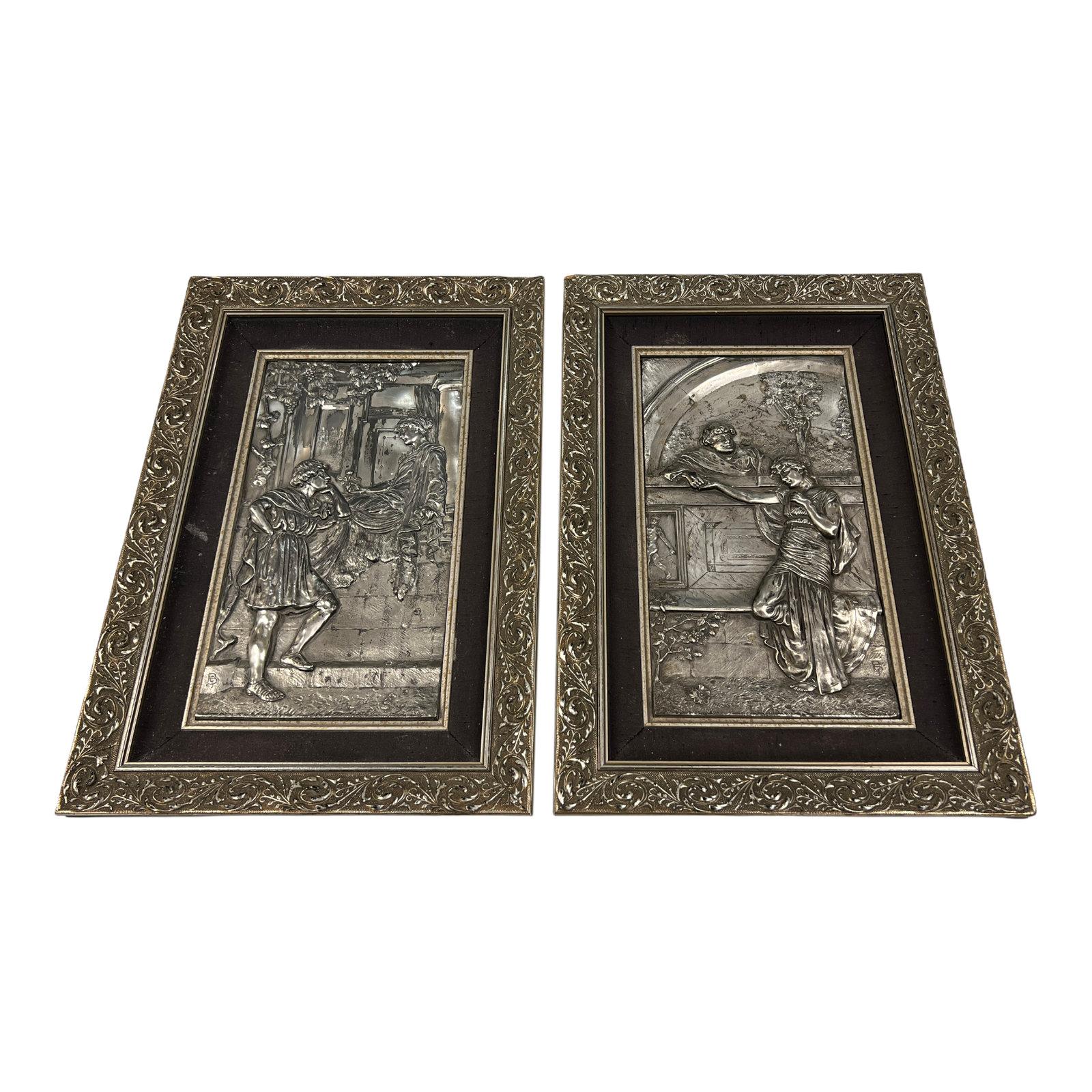 Pair of romantic silvered metal framed plaques depicting figures in the Roman neoclassical style. Signed with monogram GB (or BG).