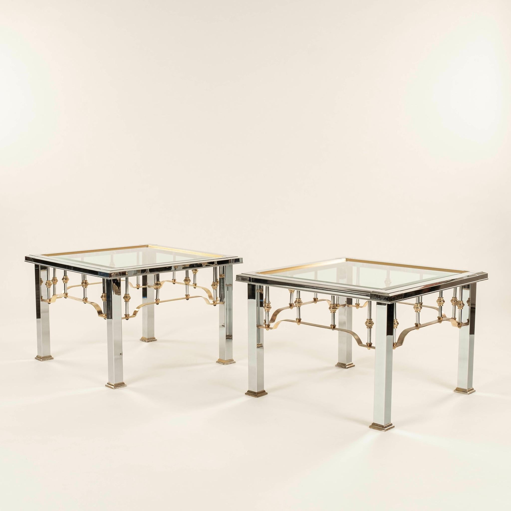 Pair of Romeo Rega style side tables featuring chrome and brass balusters and a glass top.