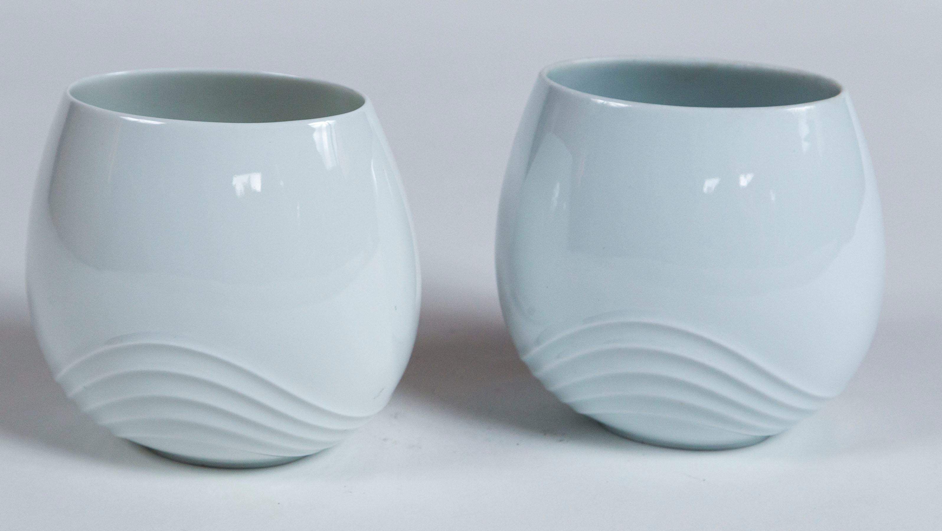 Pair Rosamonde Nairac vases for Rosenthal, circa 1960's. White porcelain with raised, wavy pattern.