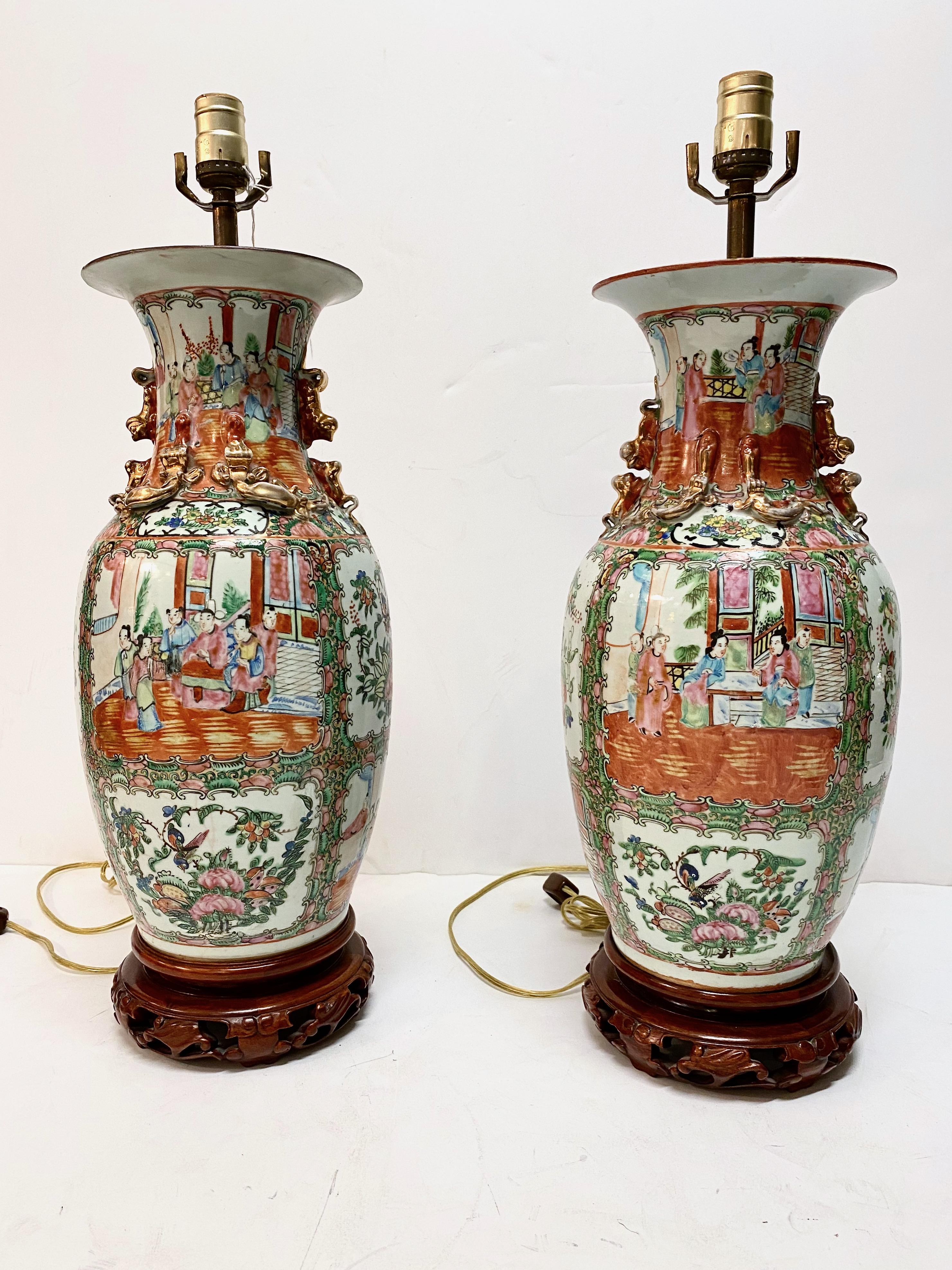 This is a large pair of Rose Canton/Famille Rose vases that have been fitted as lamps. The vases date to the late Ching Period. The large size of the lamps--32