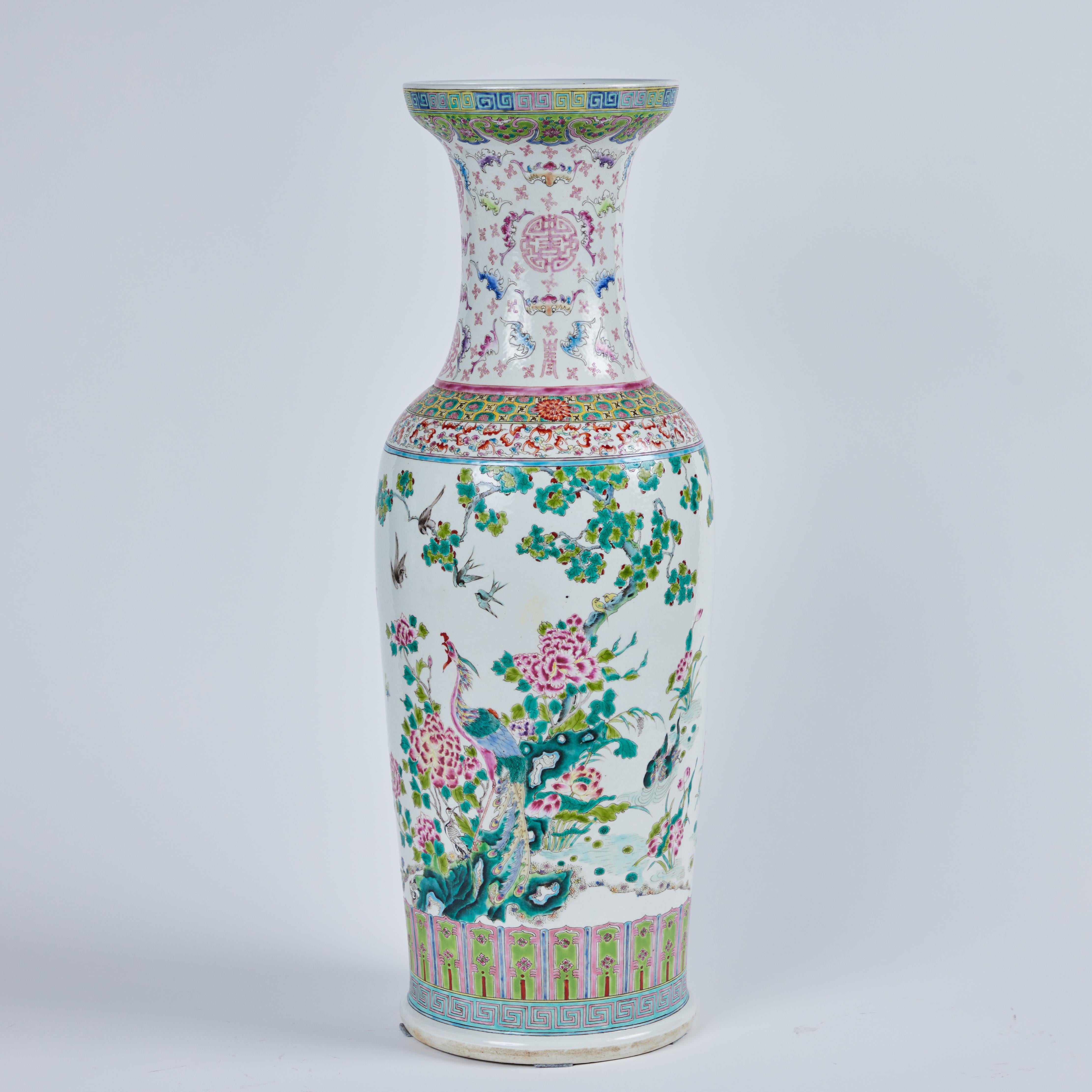 A pair of hand painted, Rose Canton patterned, porcelain vases featuring phoenix birds and flora design.