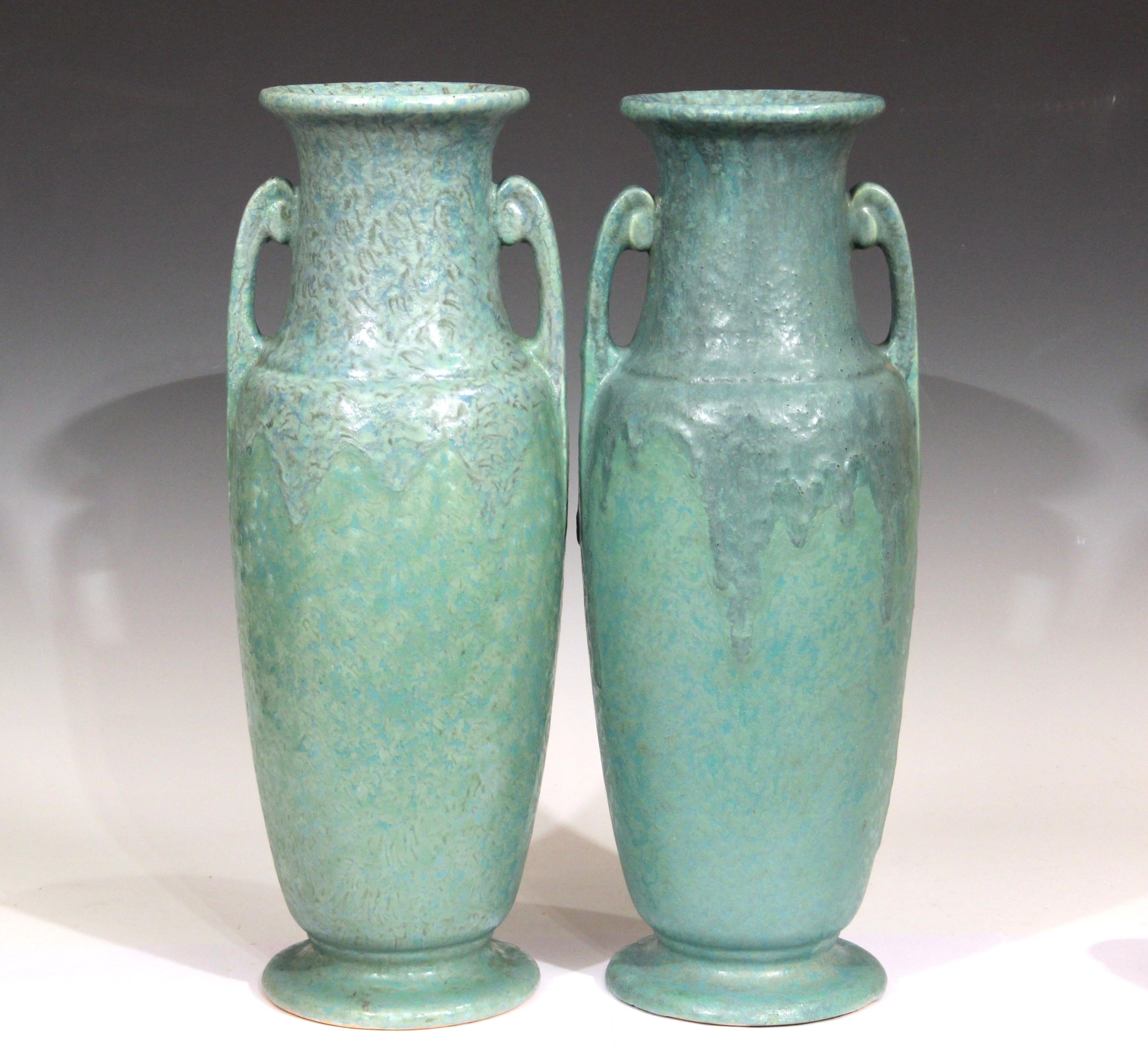 Spectacular pair of Roseville Carnelian II vases with variegated green and blue drip glaze, circa early 20th century. 18 1/4