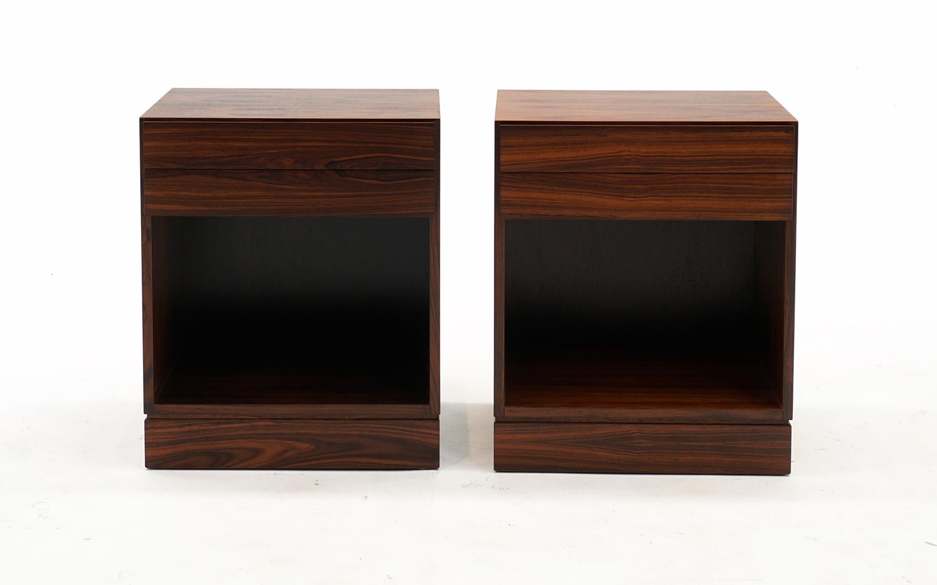 Pair of Danish Modern mid-century night stands / end / side tables in Brazilian rosewood designed by Arne Wahl Iversen, 1960s. Each with two drawers and open bottom storage. These have been expertly refinished and are in beautiful condition, ready