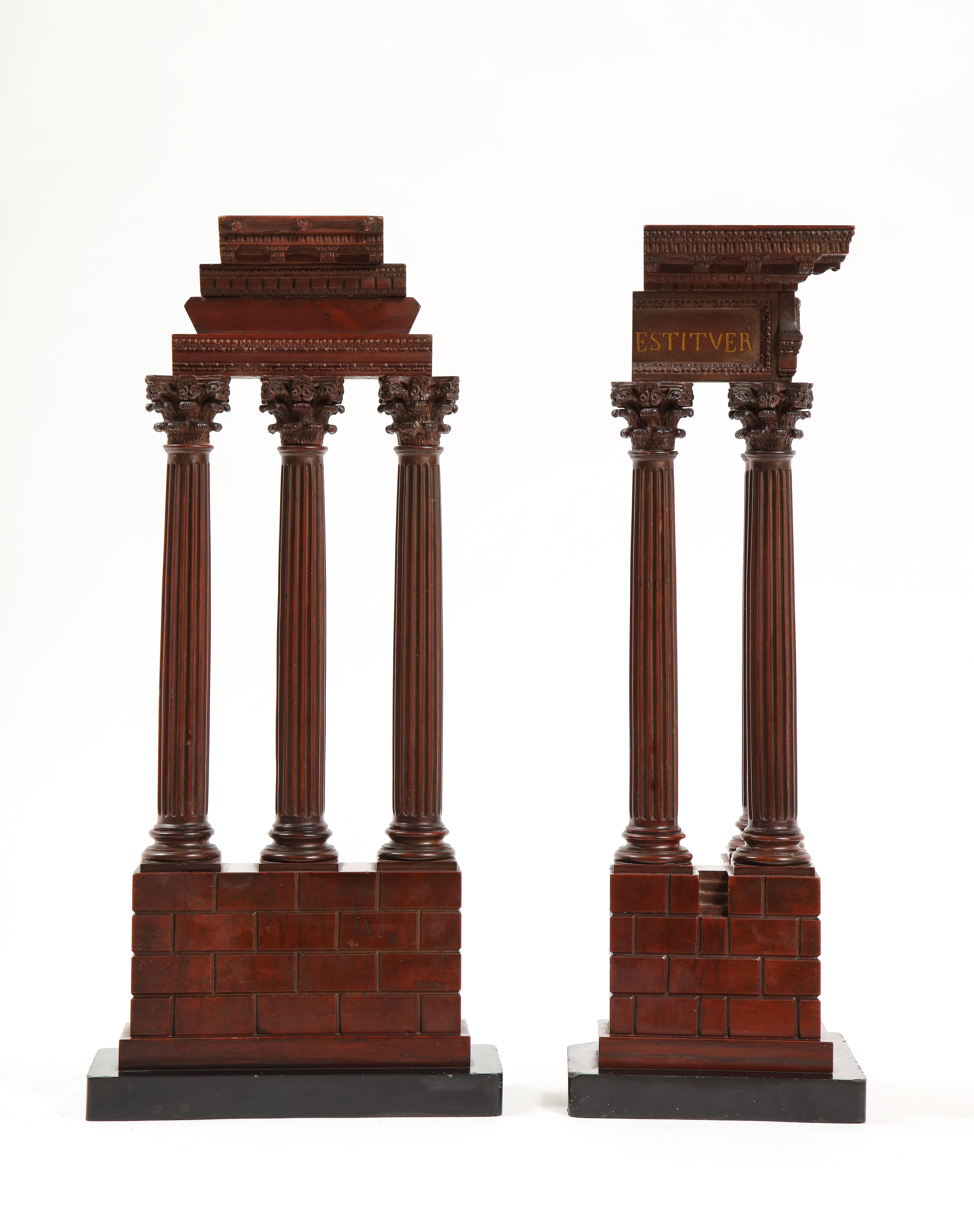A Large and Incredible Pair of Rouge Marble ‘Grand Tour’ Models of Ruins Celebrating the Corinthian Order, Most Probably Attributed To The Workshop Of Benedetto Boschetti.  The fist temple on the left representing The Temple of Castor hand-carved