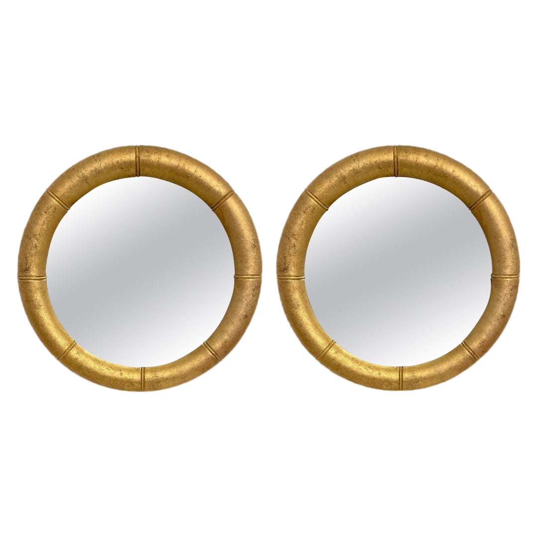 Paire de miroirs ronds dorés