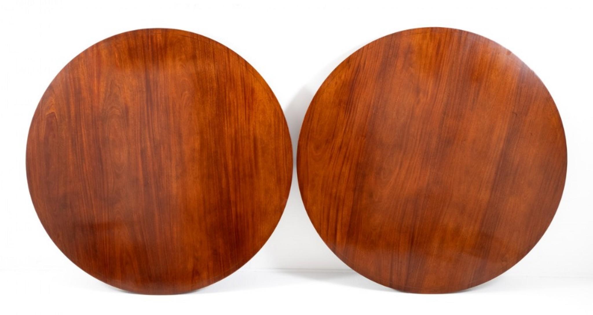 Impressive pair of mahogany circular dining tables in the Regency style
Circa 1920
These dining tables stand upon 4 swept and fluted legs with brass lions paw castors and a gun barrel column.
Each table having chequered line inlays and a fitted