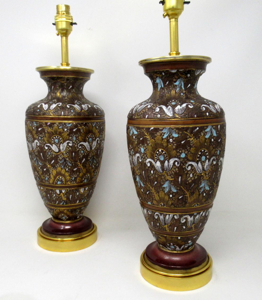 A fine pair of stylish and imposing ormolu mounted English pottery vases now converted to electric table lamps of generous proportions, mid to late 19th century. 

These exceptional vases with their lavish stylized floral decoration using autumn