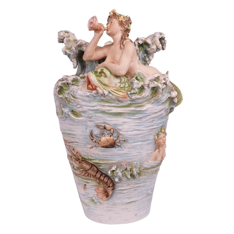 Offering these LARGE, matched PAIR of early 20th Century Royal Dux “Triton” (Merman) and “Mermaid” sea creature vases in rare, hand-painted faience (ceramic). They each depict a dimensional “sea person” (Mermaid & Triton) design with various sea
