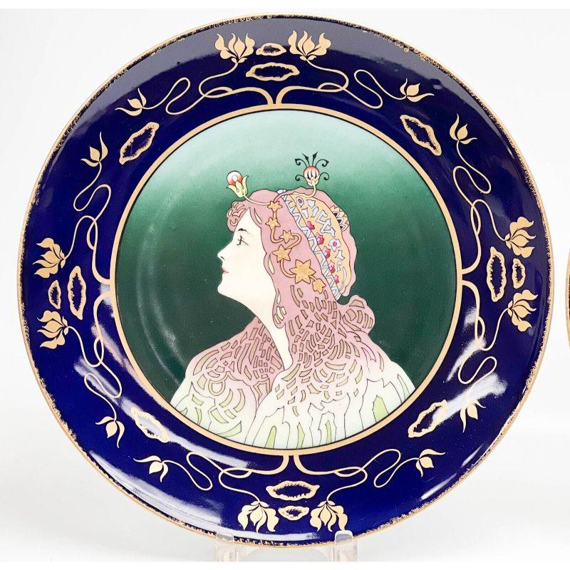 Pair Royal Vienna Austria Hand Painted Art Nouveau Porcelain wall chargers,c1890

A cobalt blue ground to the edge with gilt flower decoration. Image to the center of each of an art nouveau-style woman with raised gilt beaded accents. Underside