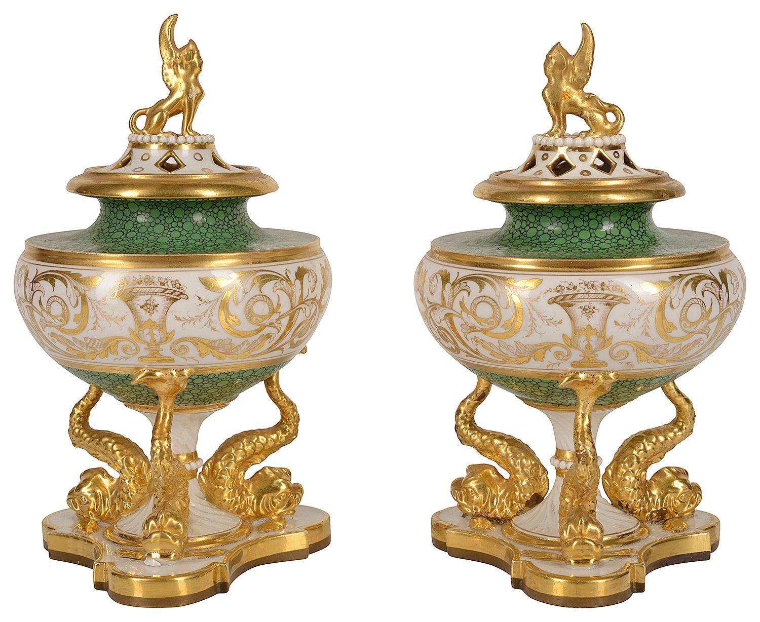 A fine and rare pair of early 19th century Royal Worcester, Flight Barr & Barr hand painted porcelain lidded urns. Each with this wonderful green ground, the pierced lids with gilded sphinks finials, classical scrolling decoration with inset scenes