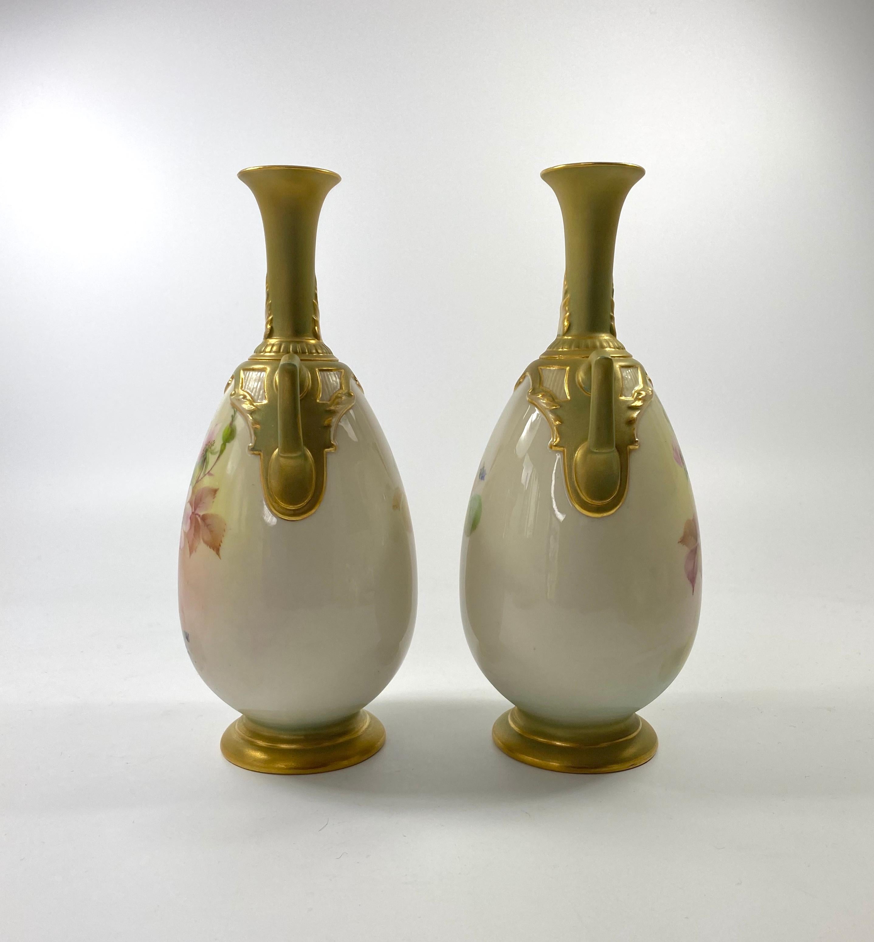 A fine pair of Royal Worcester porcelain vases, painted by George Cole, dated 1908. Each vase, beautifully painted with a study of flowering plants, beneath an arch and scroll moulded border. A smaller spray of flowers to the reverse.
Both vases