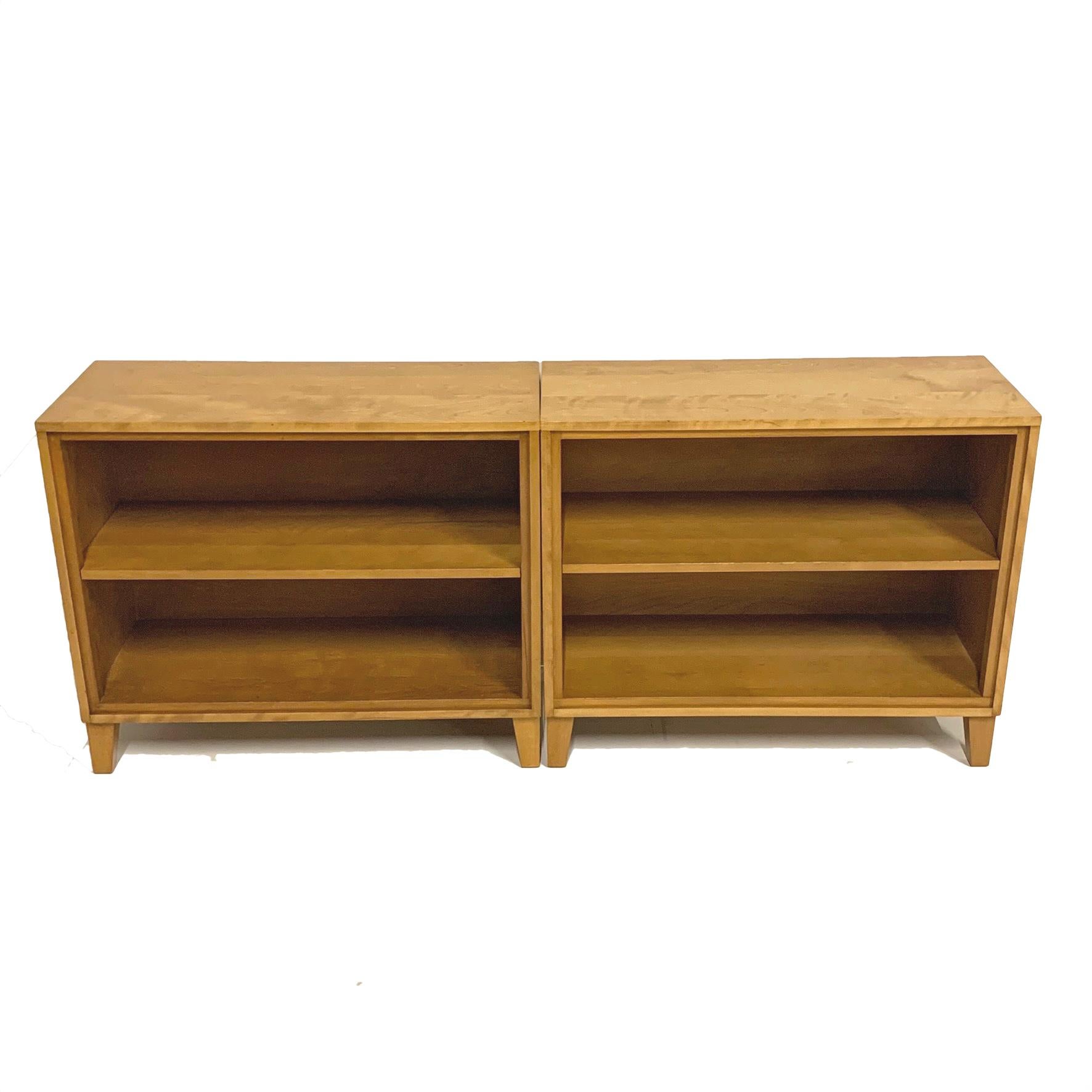 Lovely pair of matching solid maple bookshelves or display shelves designed by Russell Wright for Conant Ball 'American Line' in excellent condition. Tops have been freshly refinished. Adjustable shelf on each piece. Excellent solid pair of