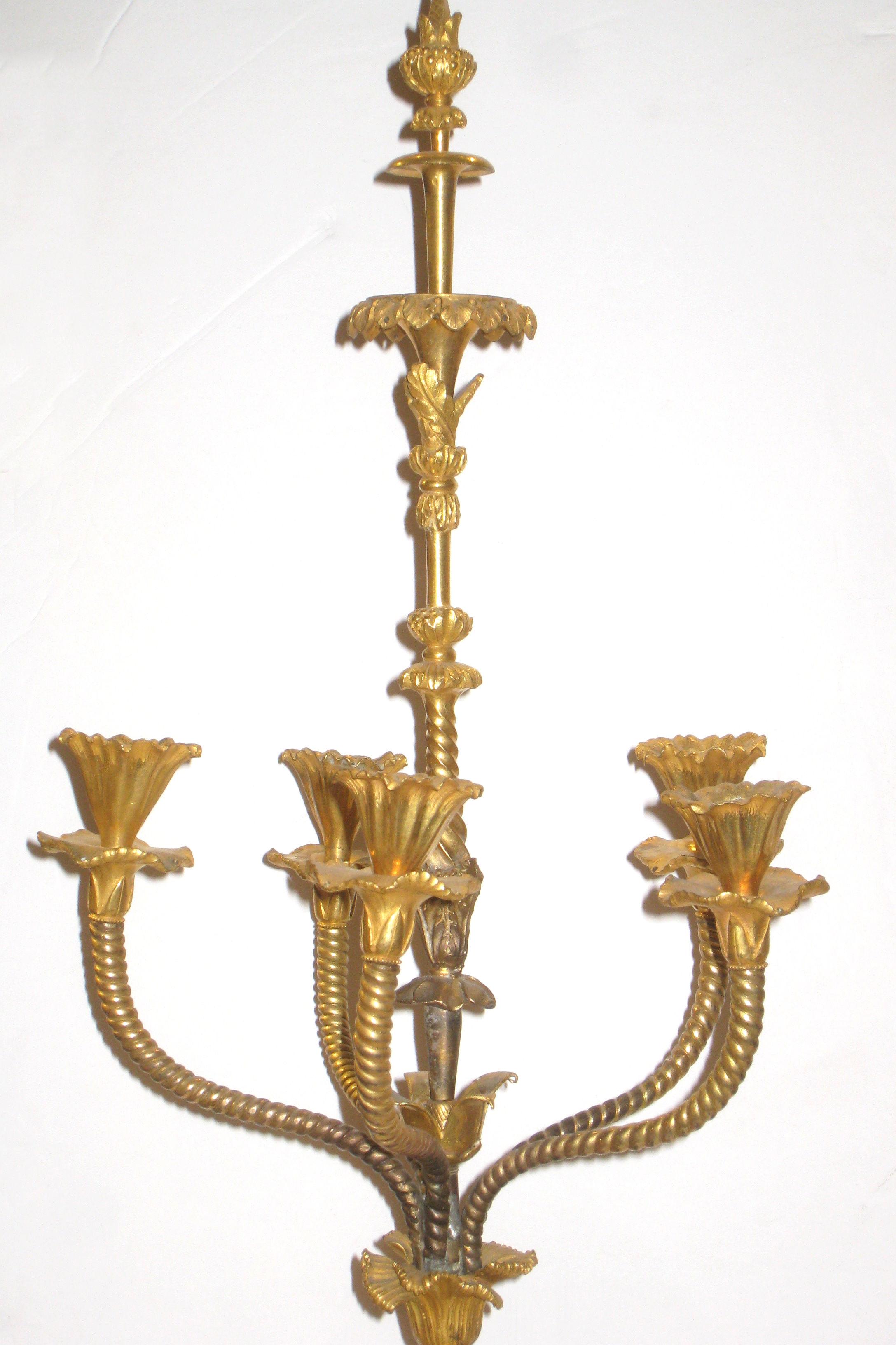 Exceptional pair of Baltic Russian 19th century ormolu bronze candelabra with rouge marble orbs mounted on bleu turquin marble bases, in the form of a neoclassical atheniennes with eagle heads. Four holes in each flower form candle cup beneath each