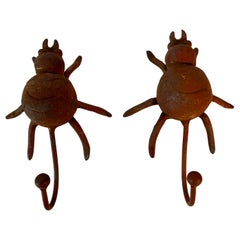 Pair Rustic and Patinated Beetle Coat Hangers