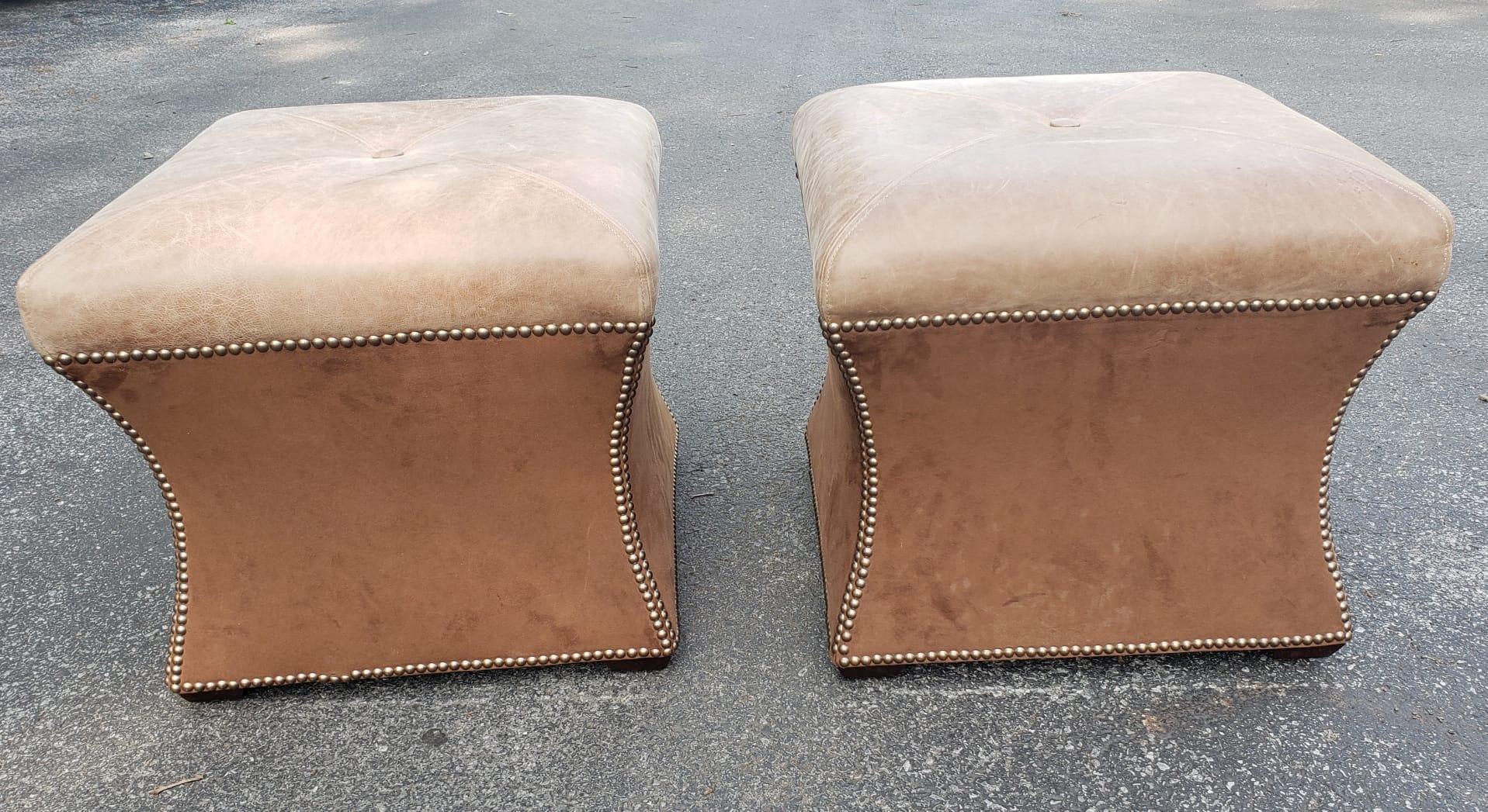 Beautiful Pair of Full Grain Leather Upholstered and distressed by design, ottomans / Stools with Nail Head Trims. Full grain leather on top and pure brown suede leather on the side. Beautiful lines of nailhead trims. Measure 21,5