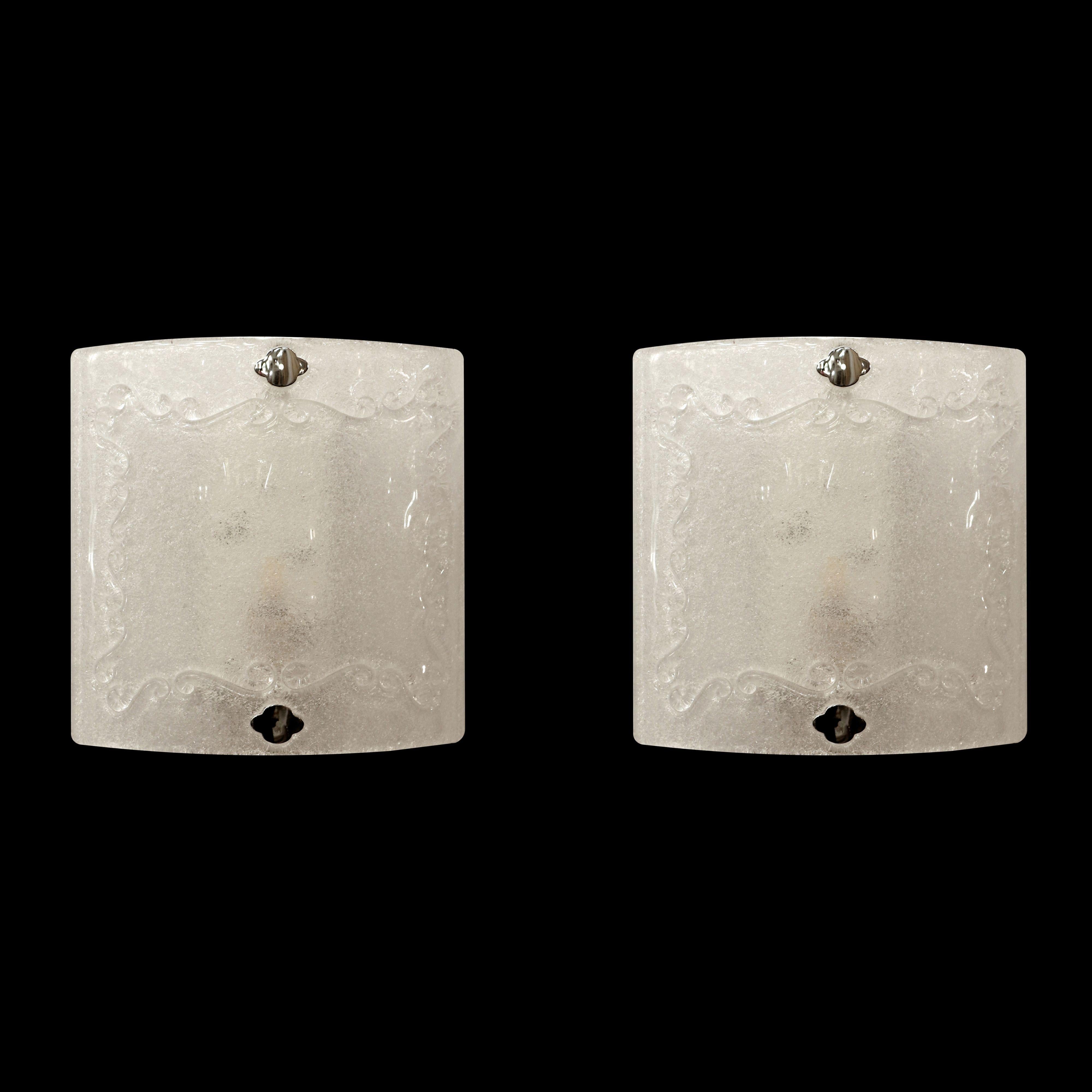 Sandcast Murano textured glass wall sconces with decorative details. These were retrieved from an estate located in Greenwich, Connecticut. The price includes restoration of cleaning and rewiring. Good condition with appropriate wear from age.