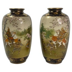 Pair Satsuma pottery vases. Samurai on horses. Kinkozan, Meiji Period.