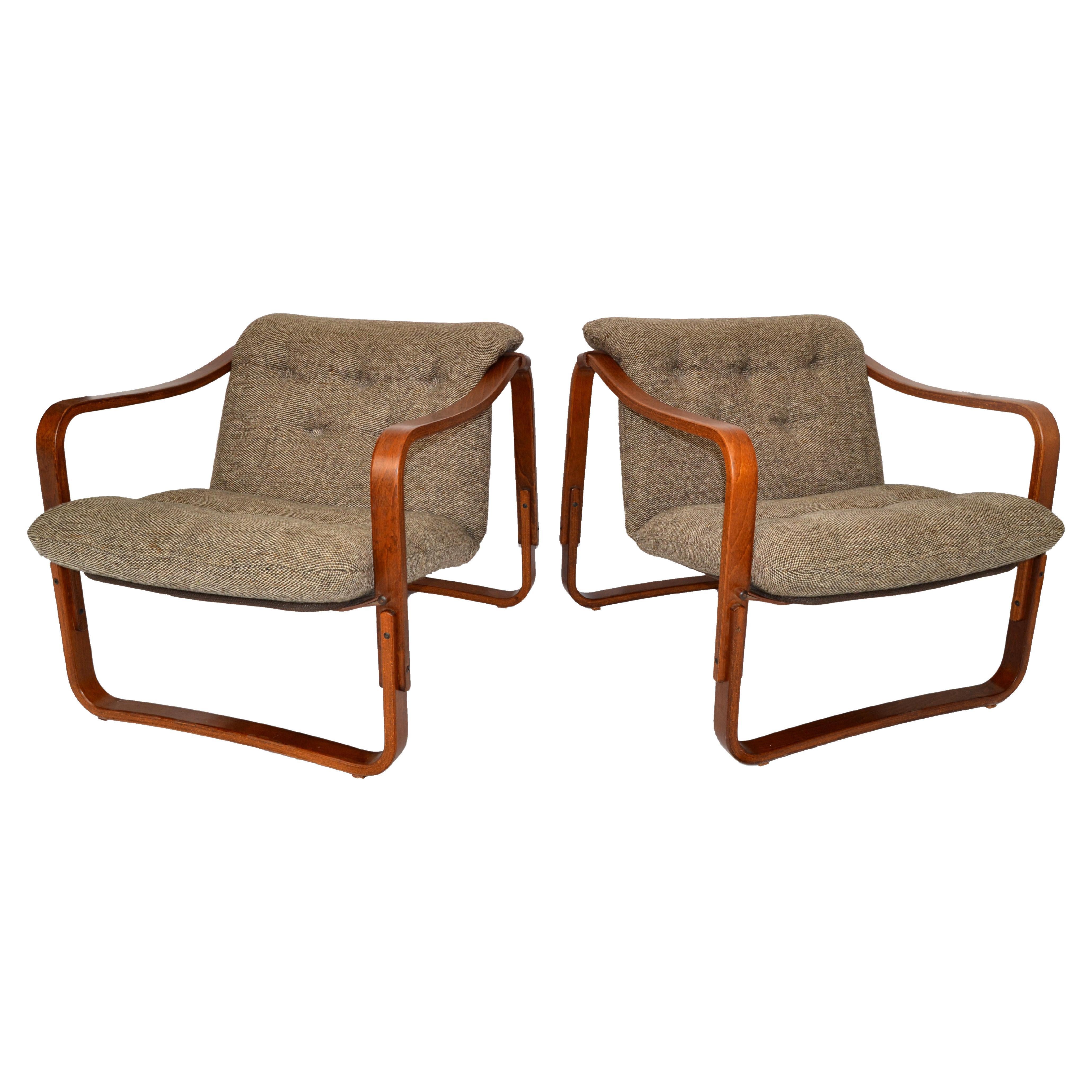 Pair of rare Ingmar Relling Scandinavian Modern Teak Bentwood lounge chairs with Leather Bindings and the original loose Wool Mix Upholstered Seat Cushions.
All handcrafted in the 1960s and made in Scandinavian.
The Condition is good vintage with