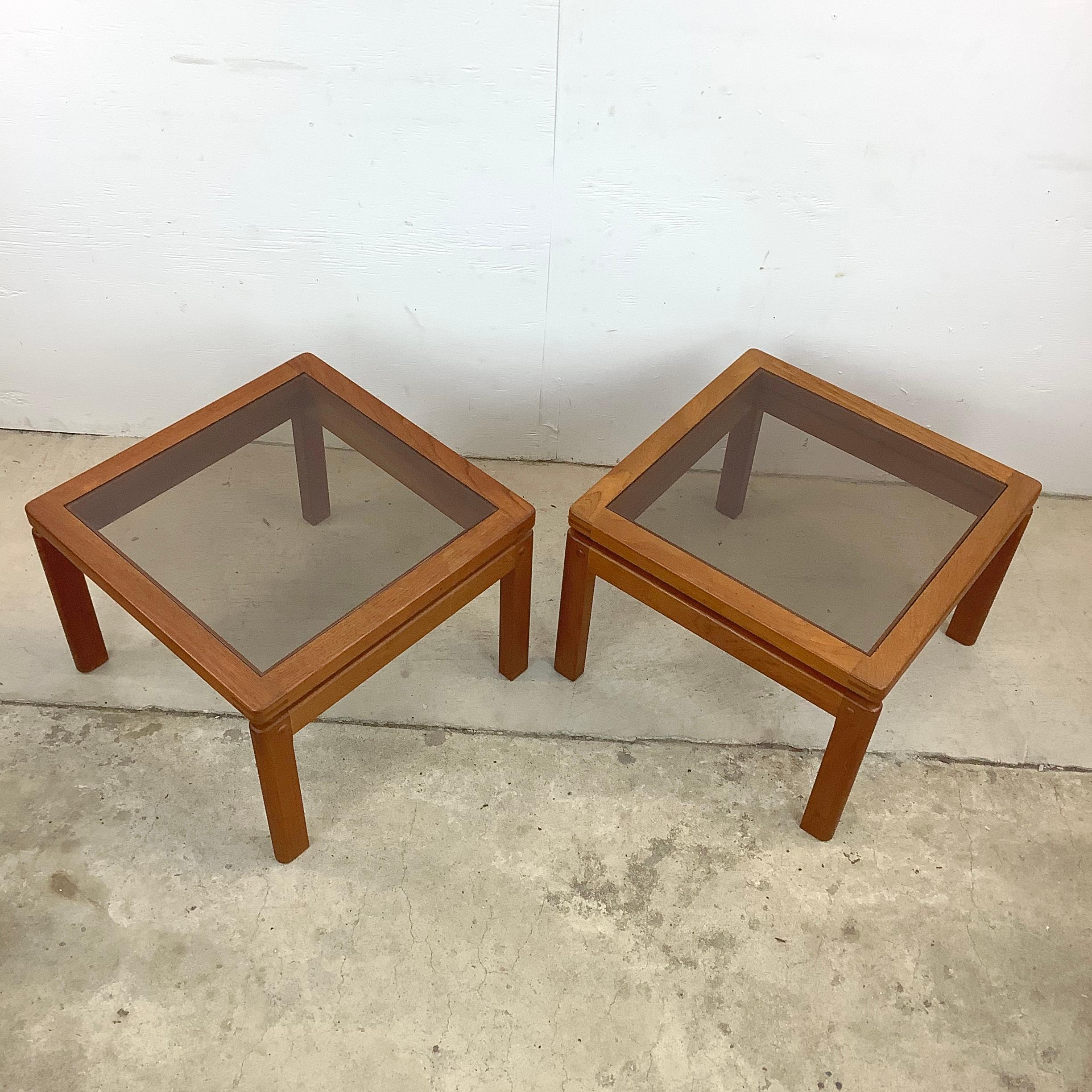 This remarkable pair of vintage Danish side tables are a testament to Scandinavian craftsmanship and timeless design. With exposed joinery and crafted from teak, these tables are a celebration of both the form and function of the 1960s.

Imagine