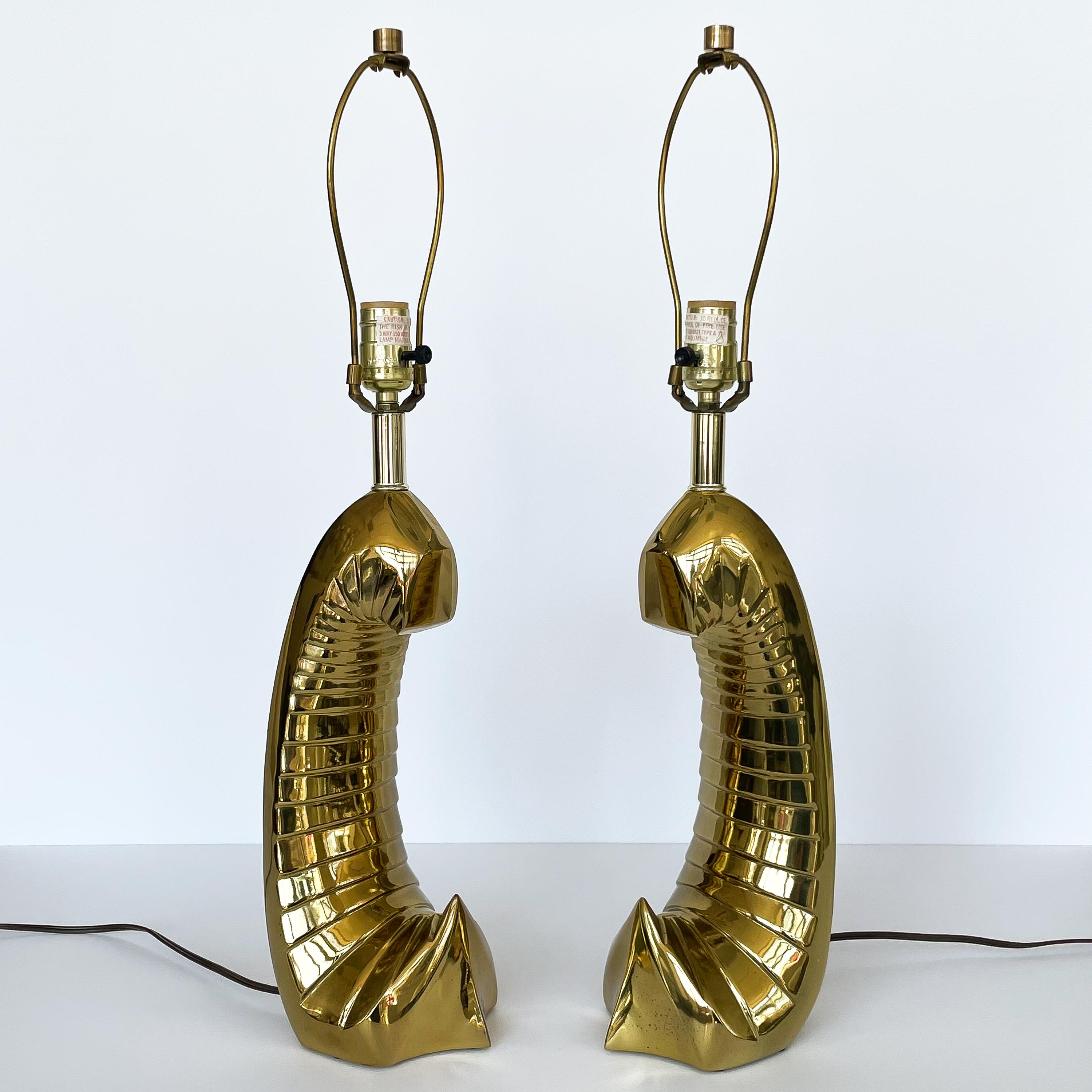 Pair of unusual modern sculptural brass table lamps by Carl Falkenstein, circa 1980s. This pair of table lamps feature a unique abstract anthropomorphic brass form. Definitely a conversation starter! Each lamp takes one standard base light bulb.