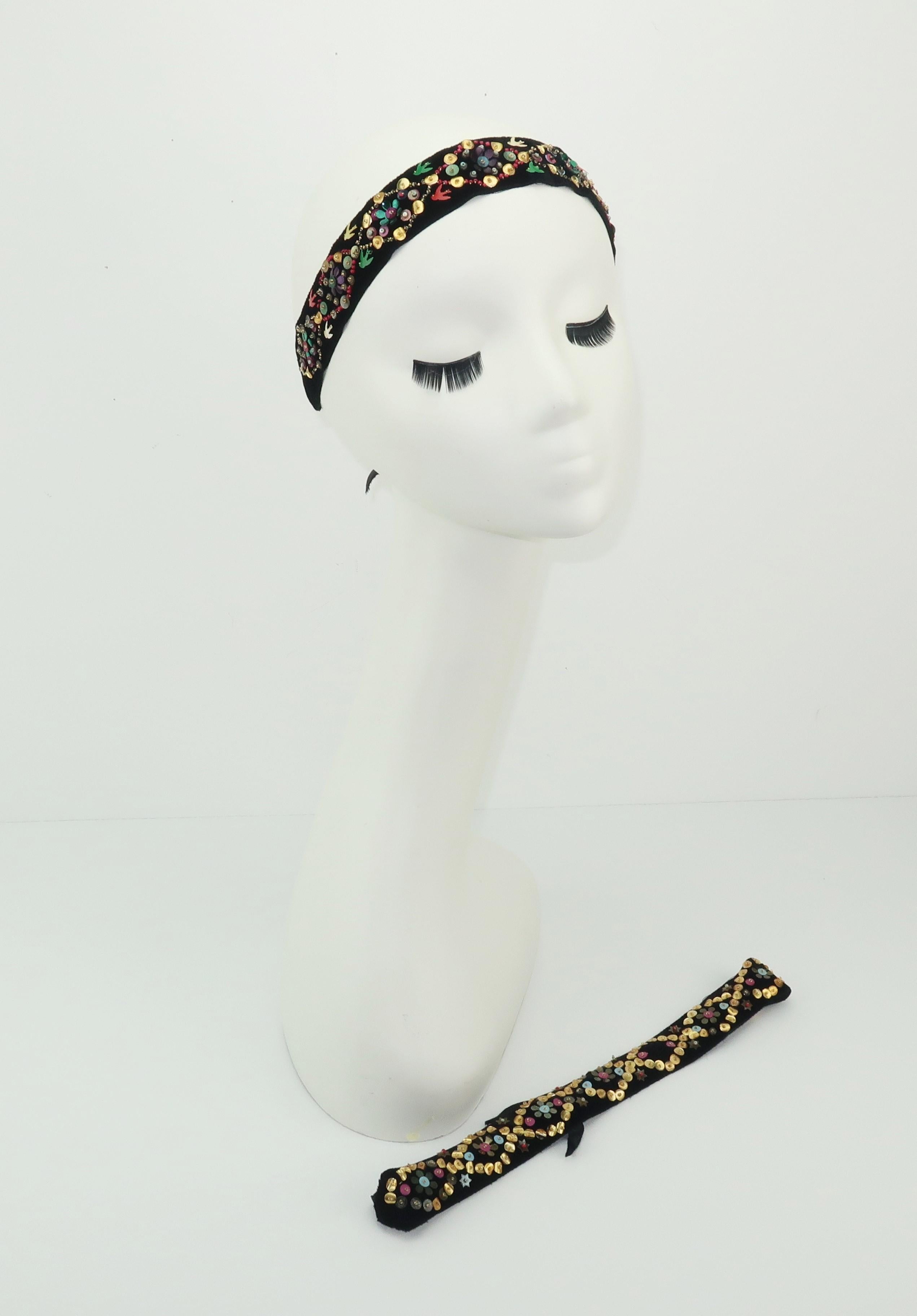 A pair of 1930's black ribbon headbands with hand sewn sequin and seed bead embellishments including a whimsical floral pattern with stars and one headband displaying birds in flight.  The black velvet is the perfect backdrop for the colorful