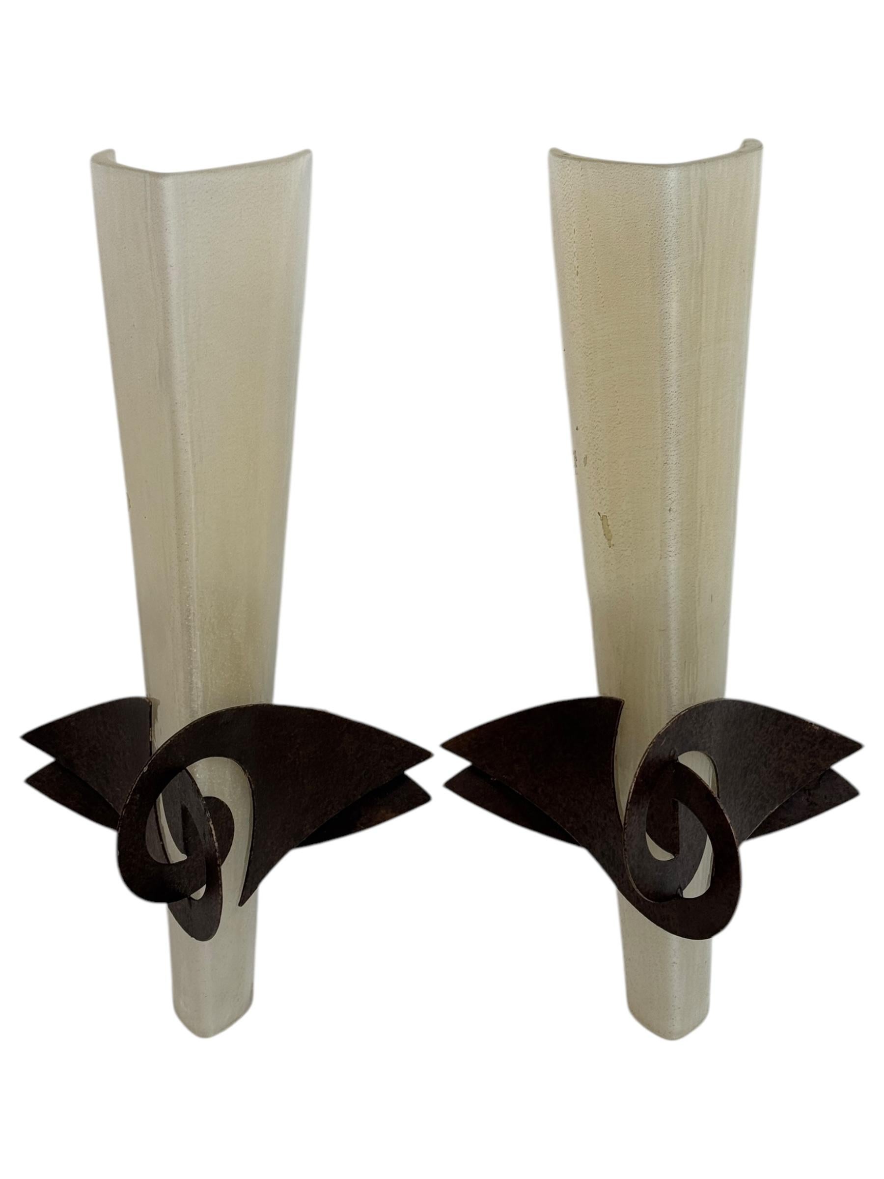 Pair of stunning wall lamps or sconces designed by Jean-François Crochet for Terzani, in Italy, during the 1980's. They are in a shape of torches. These lamps are made of handcrafted metal with a rusty finish and a gold inclusion glass shades. The