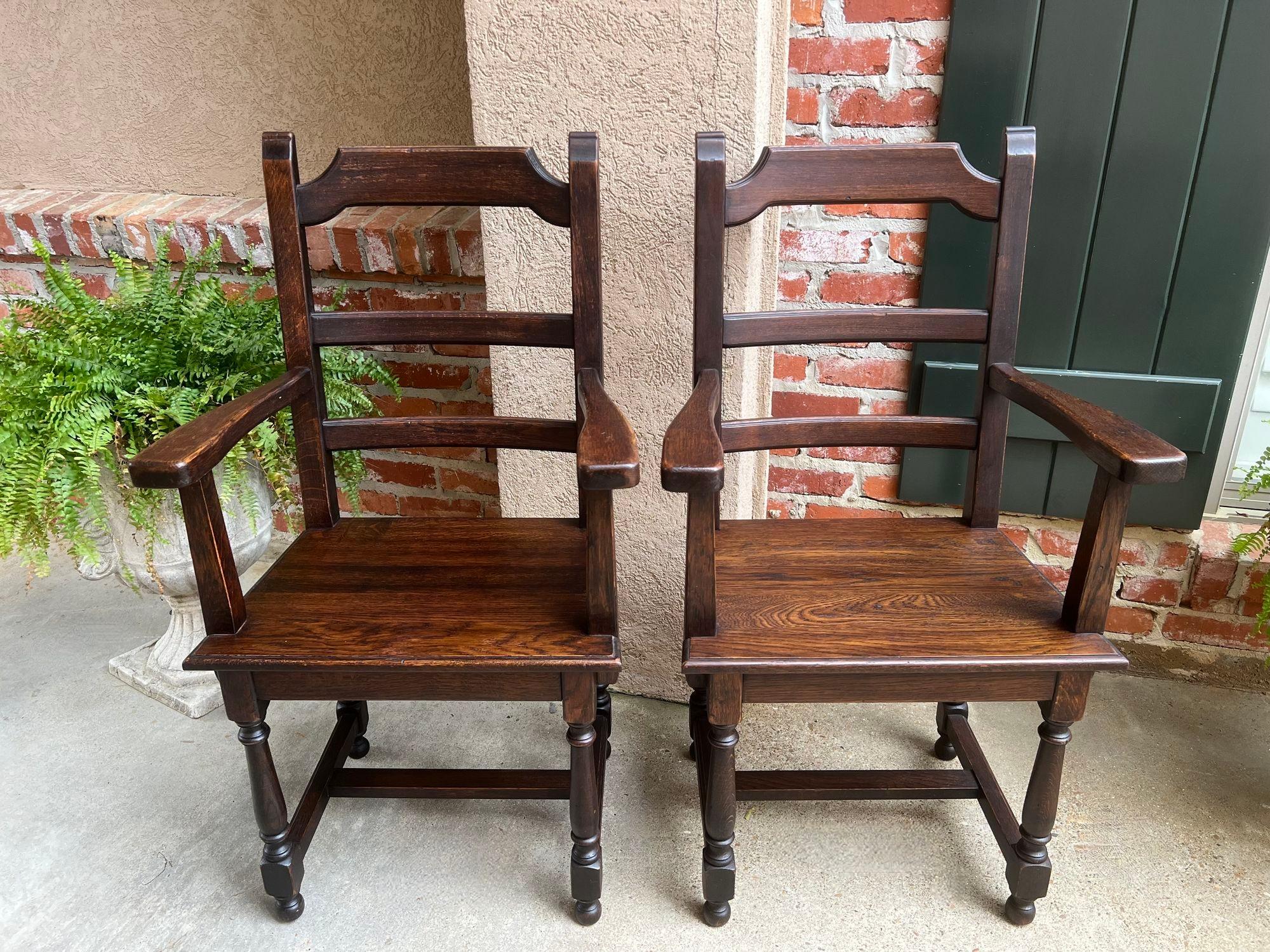 PAIR SET 2 Antique French Arm Dining Chair Ladder Back Carved Dark Oak.

Direct from France, a set of 2antique French arm chairs, with classic French style that compliments any décor! Shaped upper crown with a lovely silhouette that features wide
