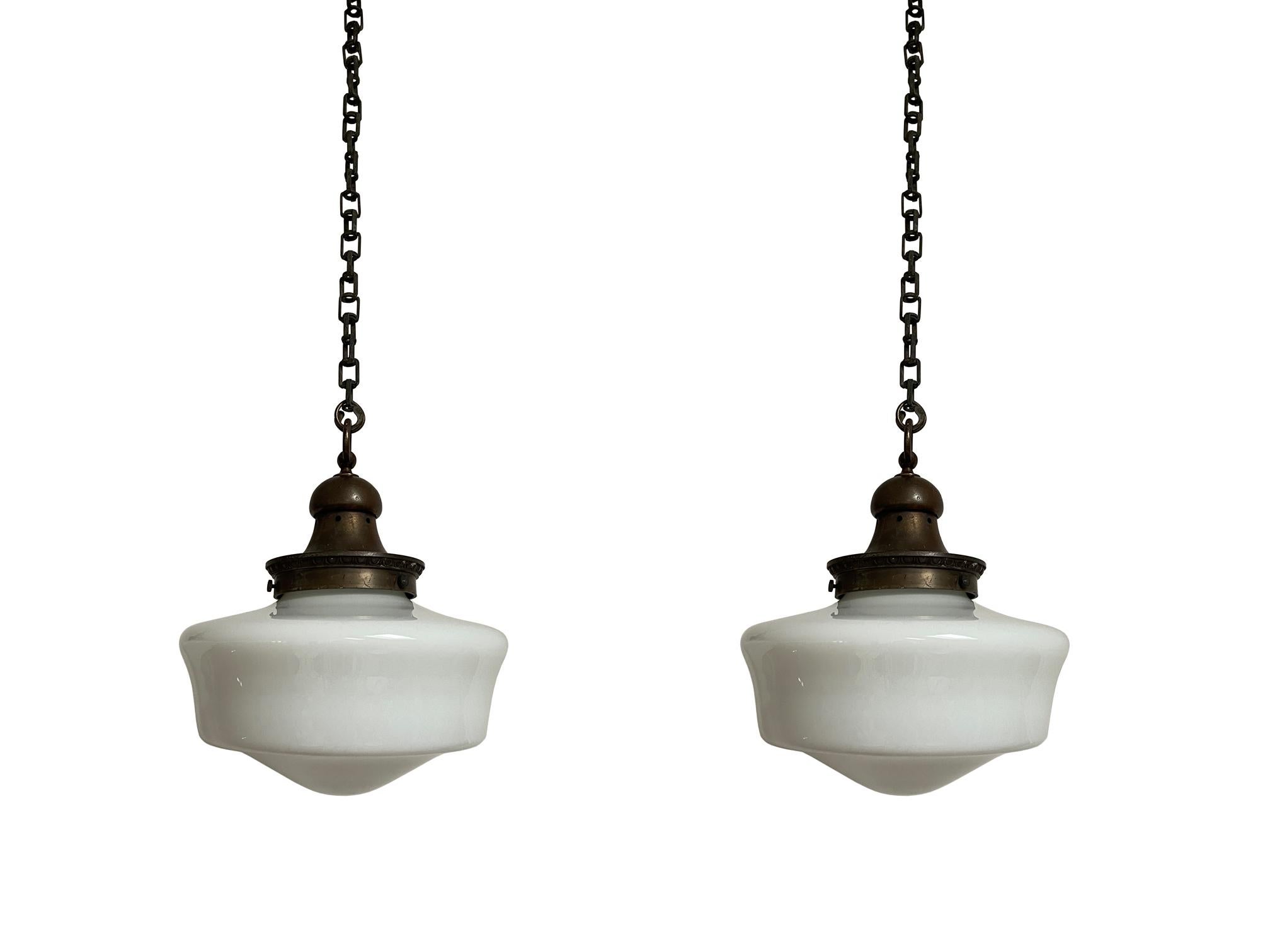 - A beautiful pair of church opaline pendant lights with heavy cast galleries, English circa 1920.
- Wear commensurate with age, all in very good condition, lovely shape to the opaline glass and unusual decorative galleries with bold original