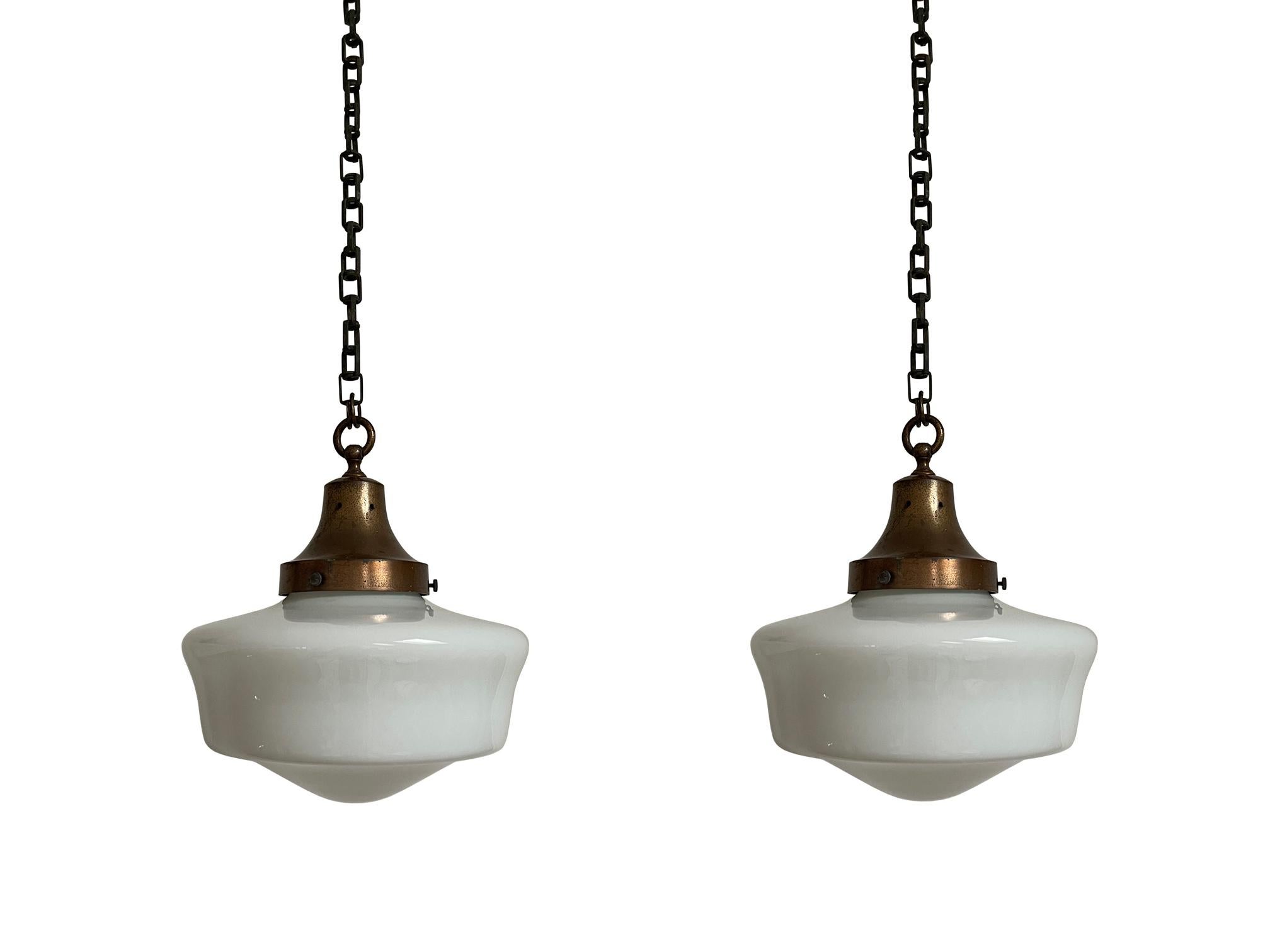 - A beautiful pair of church opaline pendant lights with heavy cast galleries, English circa 1920.
- Wear commensurate with age, all in very good condition, lovely shape to the opaline glass and unusual decorative galleries with bold original