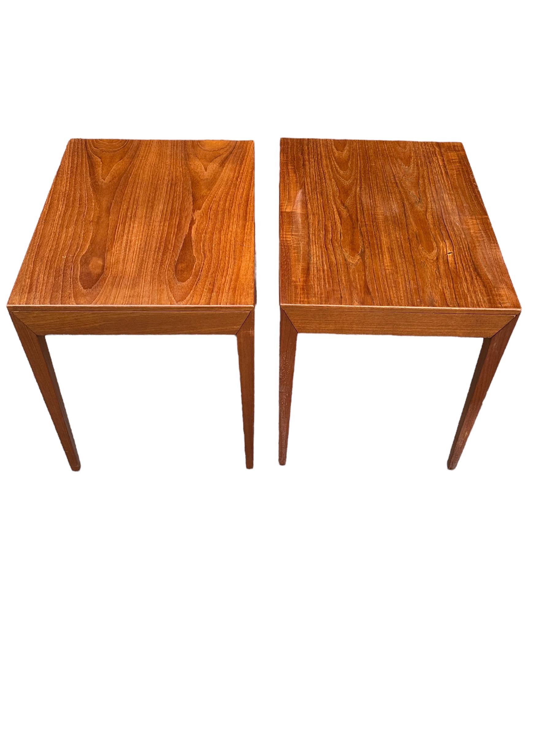 Pair of elegant teak nightstands with drawer attributed to Severin Hansen Jr for Haslev. Classic Scandinavian silhouette. The epitome of Danish design and craftsmanship. Each features a pull out drawer for storage. Large enough to support good sized