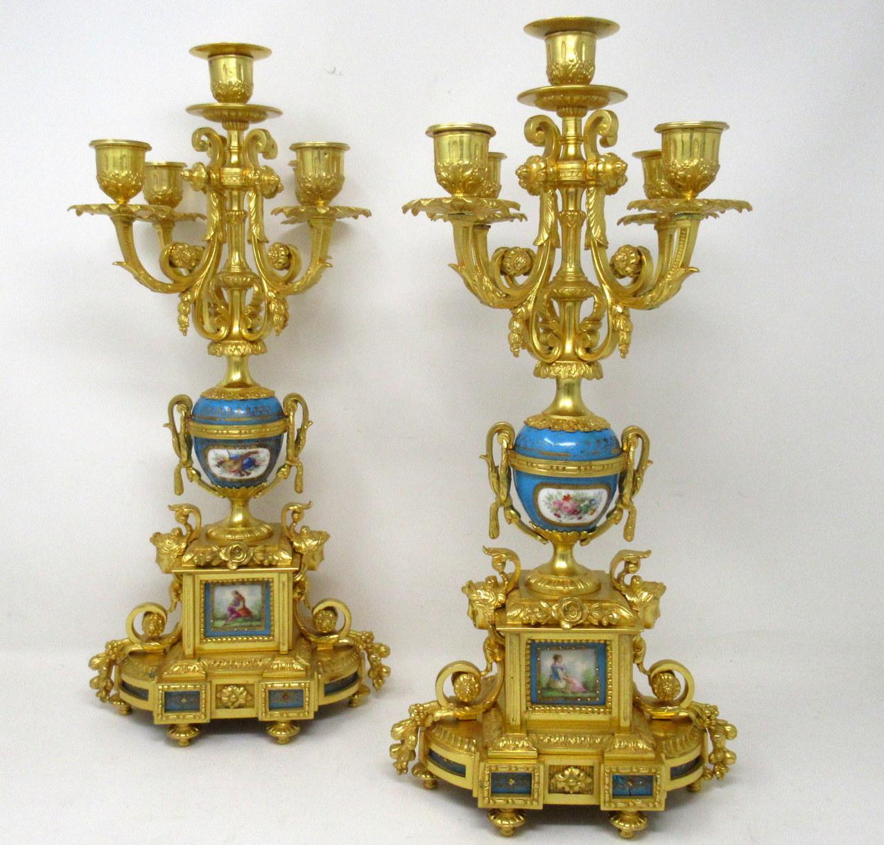 A fine stylish and imposing pair of French five light table or mantle sevres porcelain mounted Ormolu Candelabra of outstanding quality. Early to mid-nineteenth century. 

Each with four scrolling leaf capped and one central branch above a