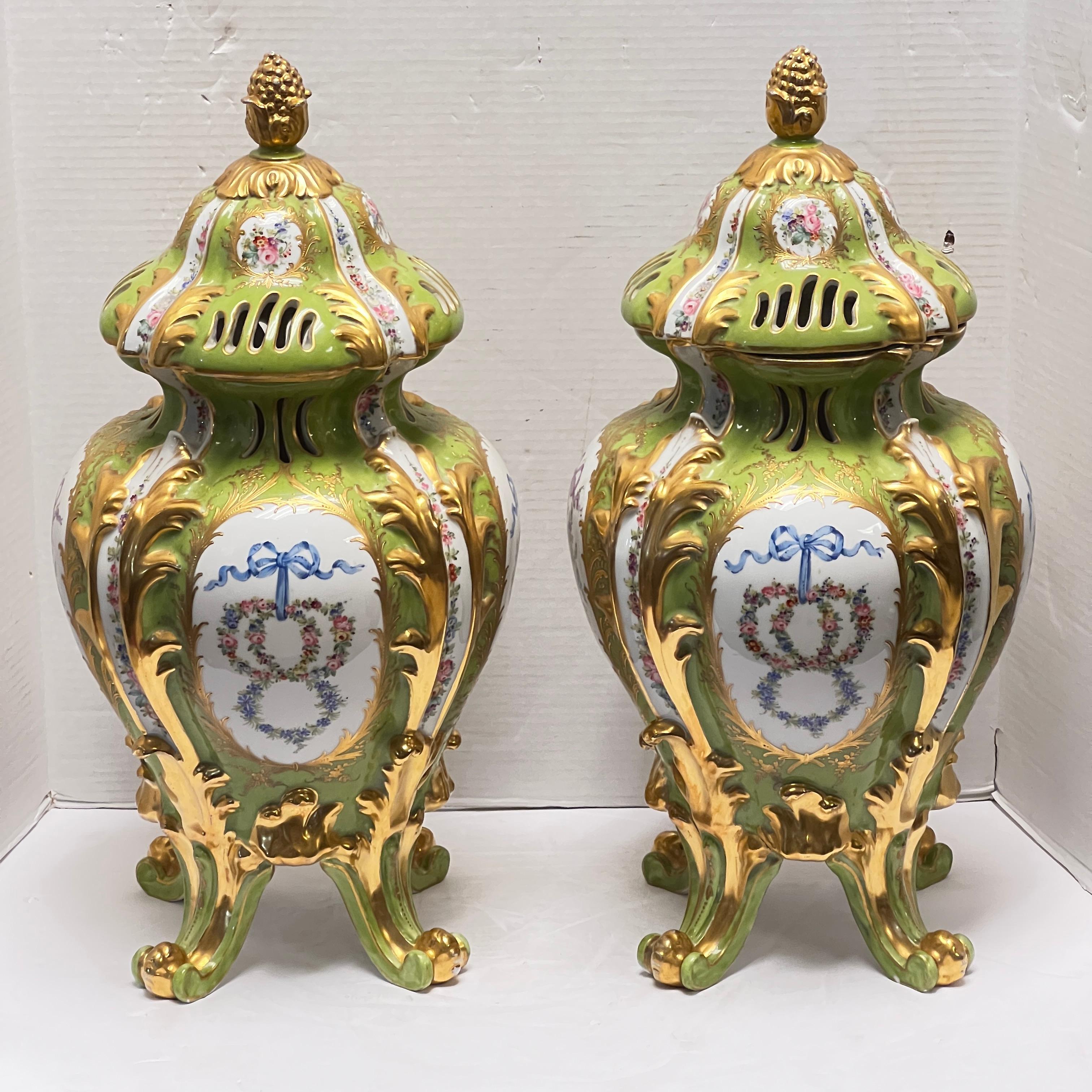 French Pair Sevres Style Floral Painted and Gilded Porcelain Urns For Sale