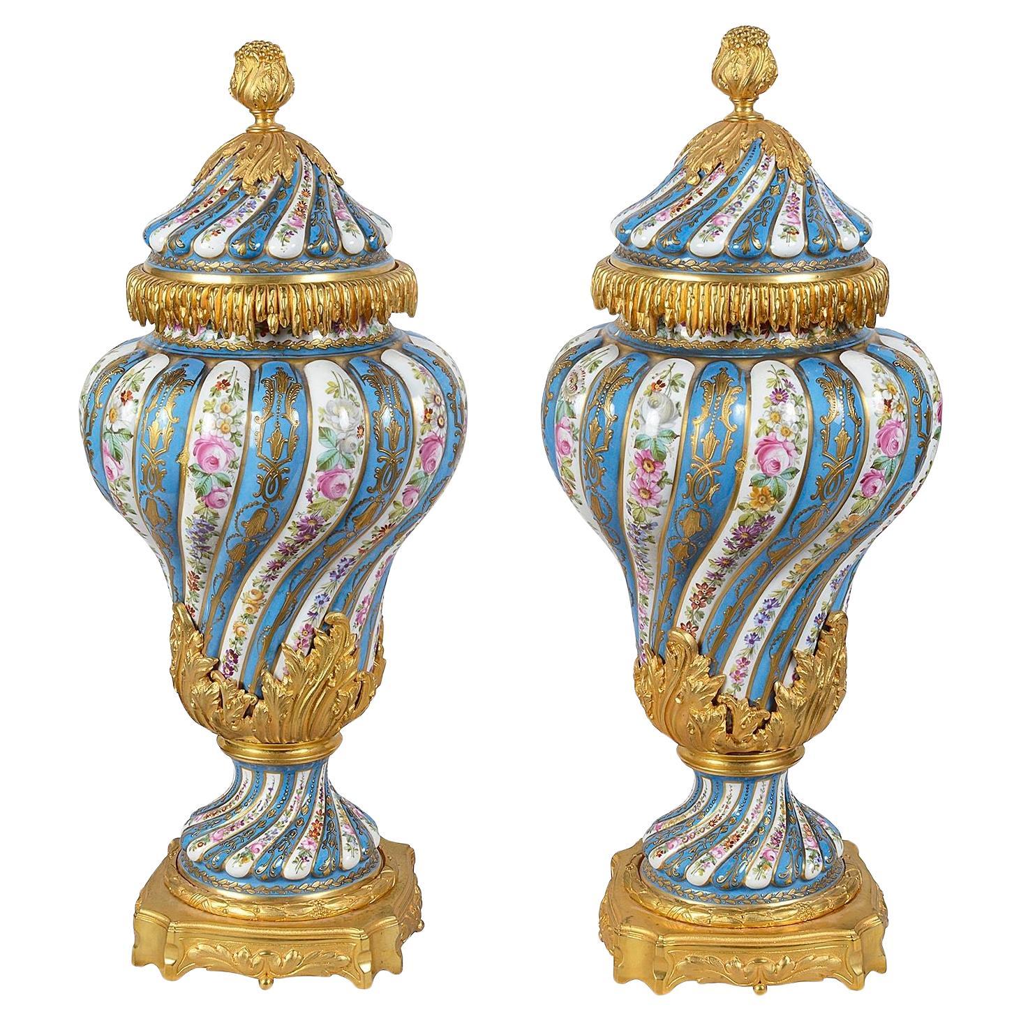 Pair Sevres style porcelain lidded vases, C19th. For Sale